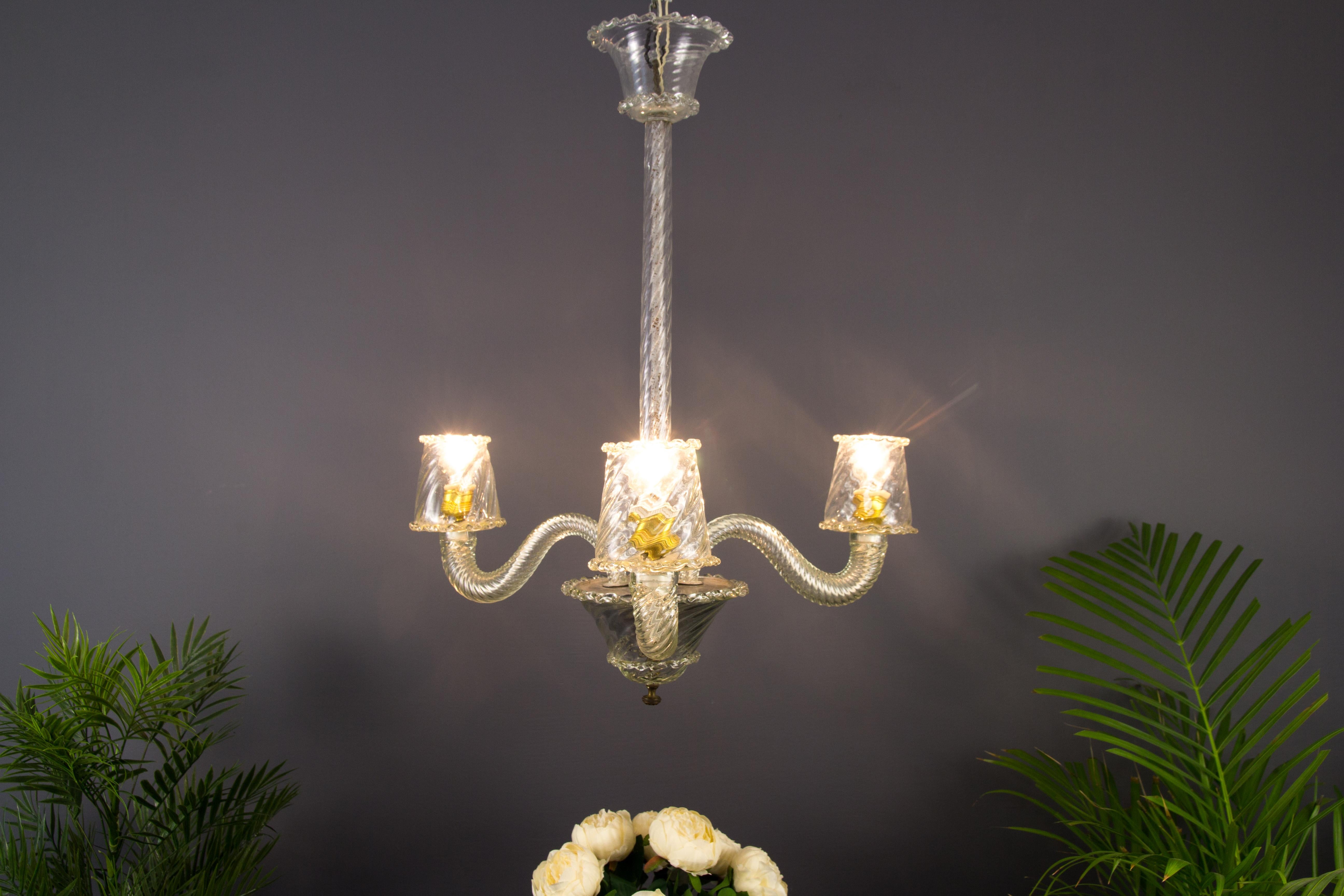 Beautiful Italian Art Deco style Murano transparent white glass chandelier from the 1930s. Three arms each with one socket for the E 27 light bulb.
Measures: Height is 26.37 in / 67 cm, diameter 21.65 in / 55 cm.
   