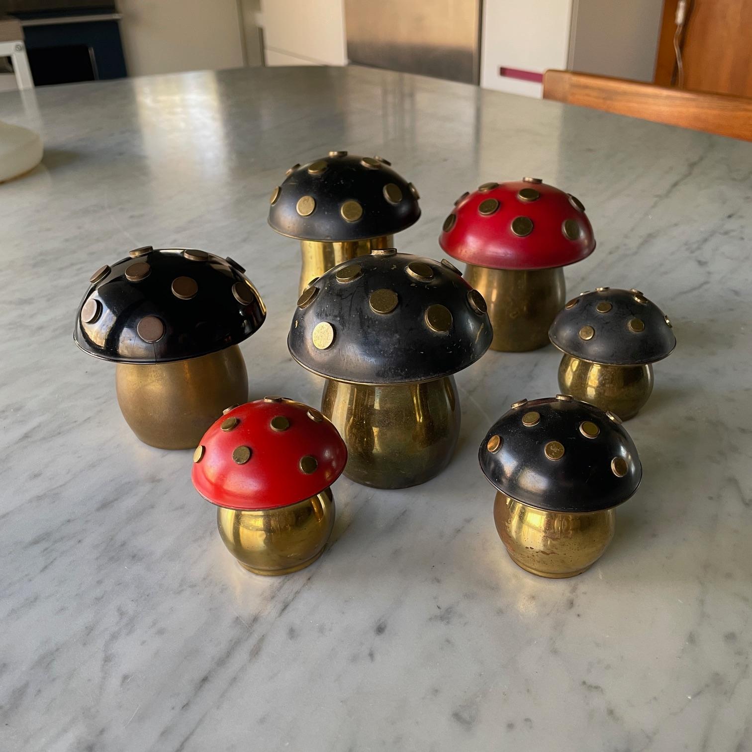 A collection of 7 mushrooms, red and black. Make for a wonderful display of old world metalsmith technics. Lids can be taken off and designed to set flat on a table surface, to be used as ashtrays.

Large Dia 3.25 x H 4, 3.5, 3.25 in
Small Dia 2.13