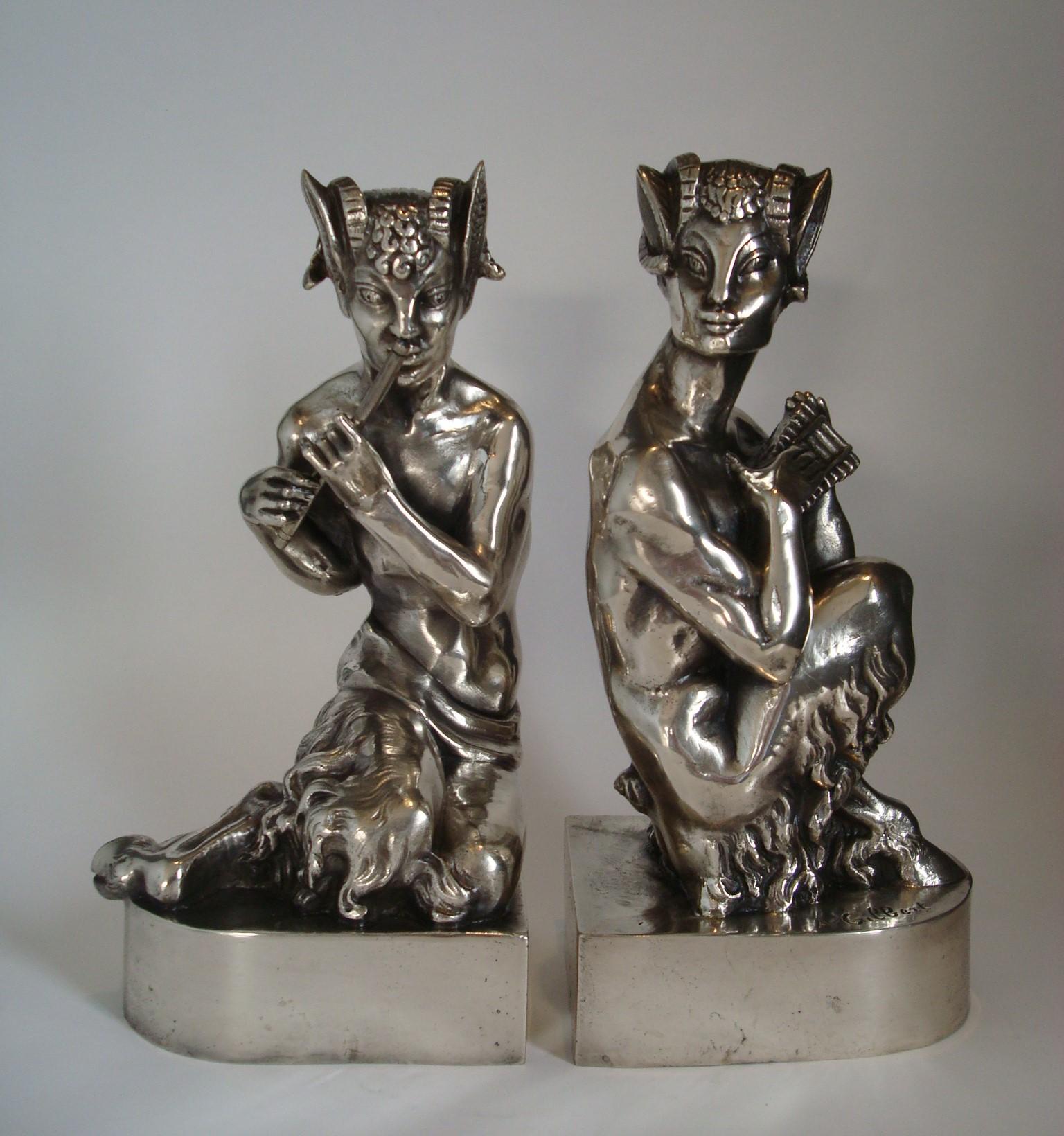 A pair of Art Deco Faun bookends, circa 1925
silvered bronze, the faun kneeling, one with a pan flute, the other with a pipe
height of each 24.5cm, signed 'A.Gilbert' in the cast, both stamped 'D2'.
Paire de serres livres en bronze. 20th