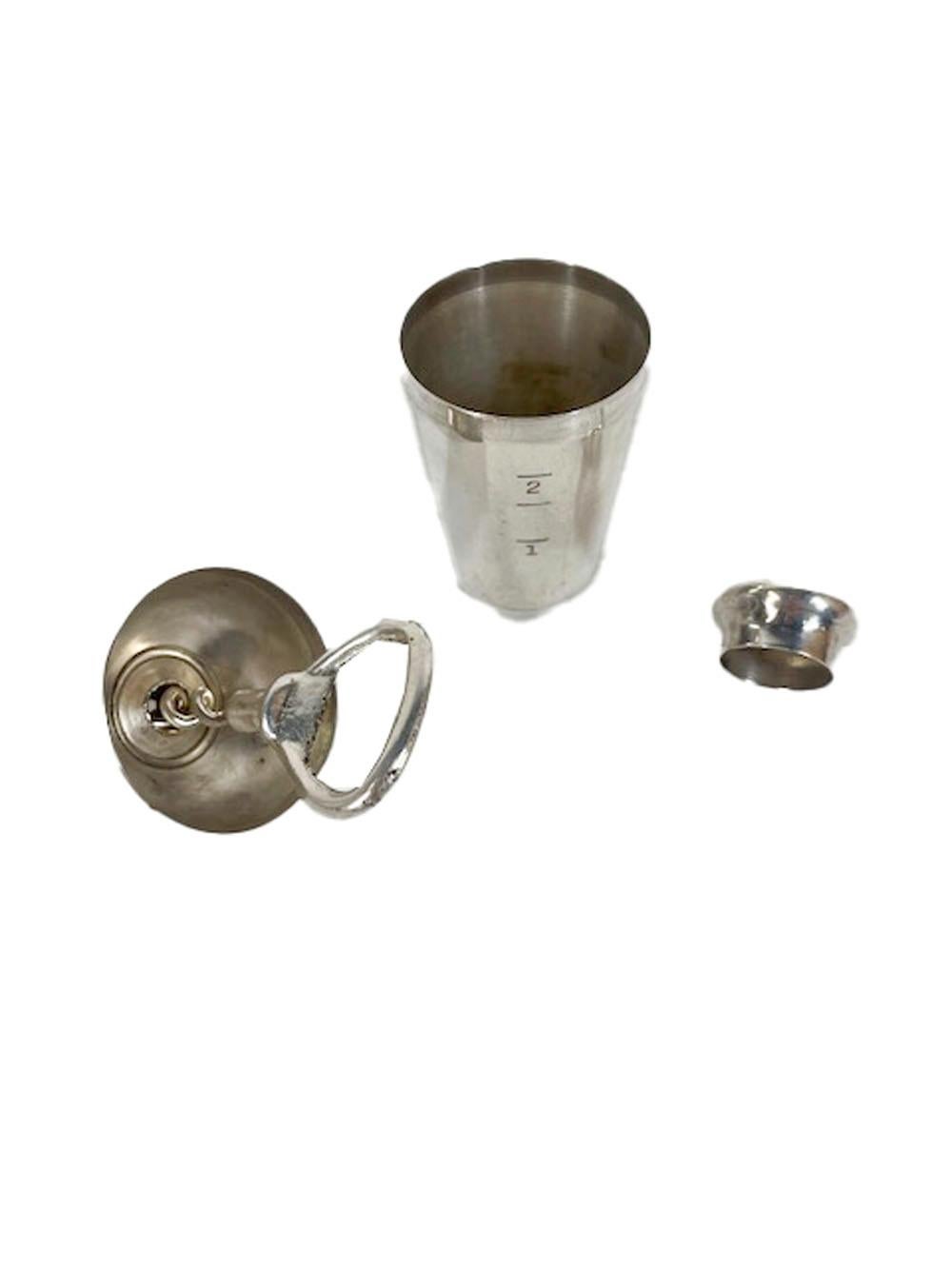 Silver plated jigger in the form of a miniature cocktail Shaker by Napier. The base with 1, 2 &2.5oz markers to measure spirits, the top with a removable cap transforms into a funnel for filling bitters or vermouth bottles, finally a corkscrew /