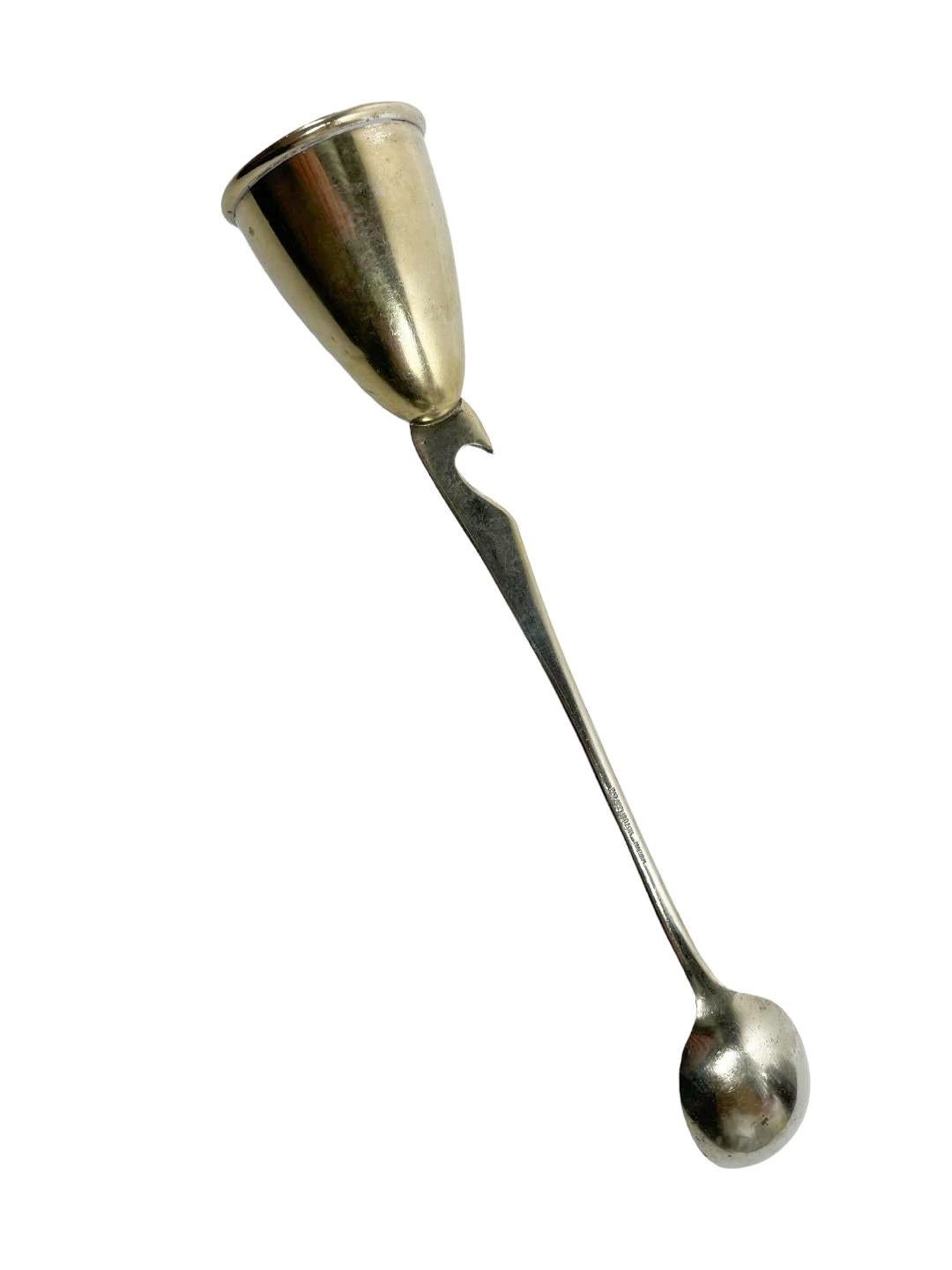 Silver plate Art Deco stir spoon with jigger / spirit measure top and a bottle opener built into the handle. Made by Napier Co.