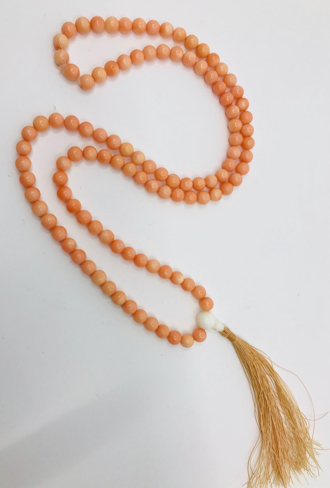 Art  Deco natural color , antique Angel skin Coral Necklace consists of 108 beautiful rare beads , 1.5 cm  white Coral enhancement and 10 cm natural color  silk fringe.