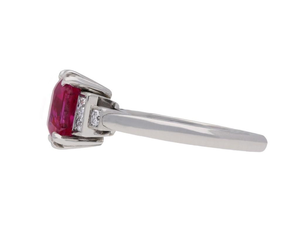 Art deco natural Burmese ruby and diamond ring. Set with an octagonal double brilliant cut natural unenhanced Burmese ruby to centre with an approximate weight of 2.67 carats in an open back double corner claw setting, flanked by six square French