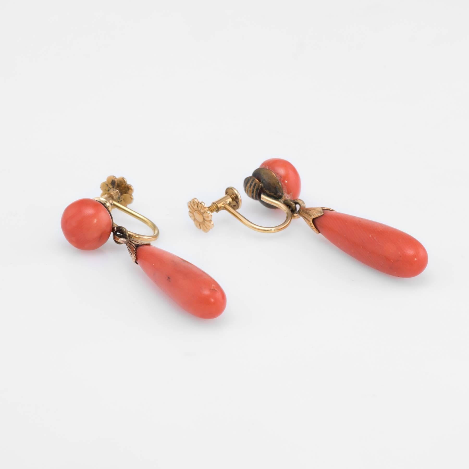 Overview:

Elegant pair of vintage Art Deco era earrings (circa 1920s to 1930s), crafted in 18k yellow gold. 

Natural coral measures 23mm x 6.5mm (lower) and 8.5mm (upper). The coral weight I s estimated at 5.75 carats. The coral is in excellent