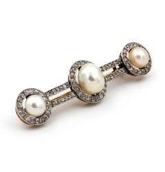 Art Deco Natural Pearl Diamond Brooch in Platinum and 18 Karat Gold, circa 1920