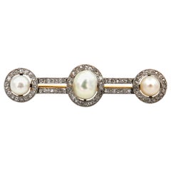 Antique Art Deco Natural Pearl Diamond Brooch in Platinum and 18 Karat Gold, circa 1920