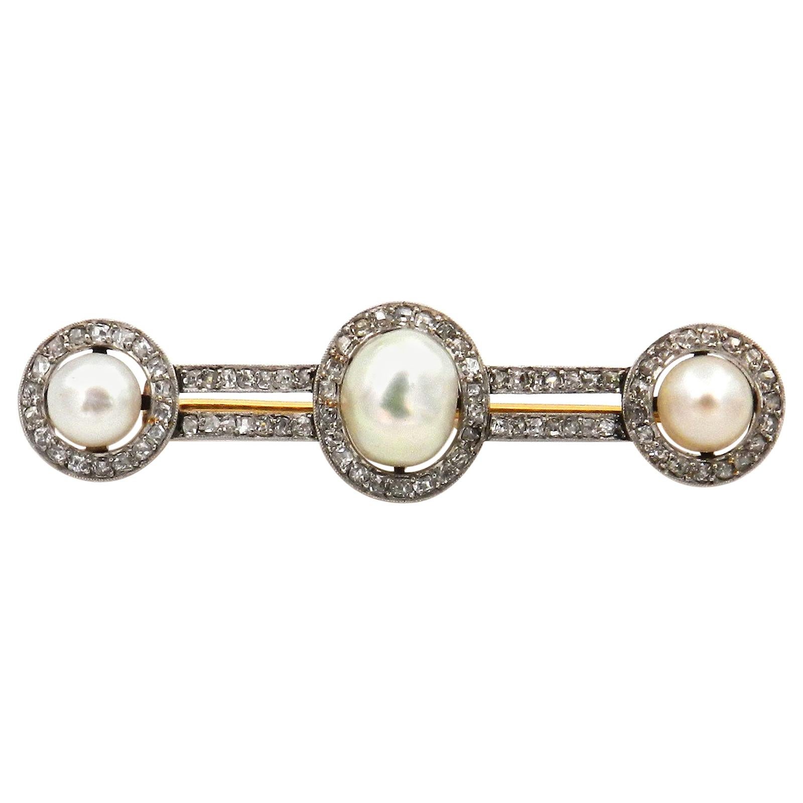 Art Deco Natural Pearl Diamond Brooch in Platinum and 18 Karat Gold, circa 1920 For Sale
