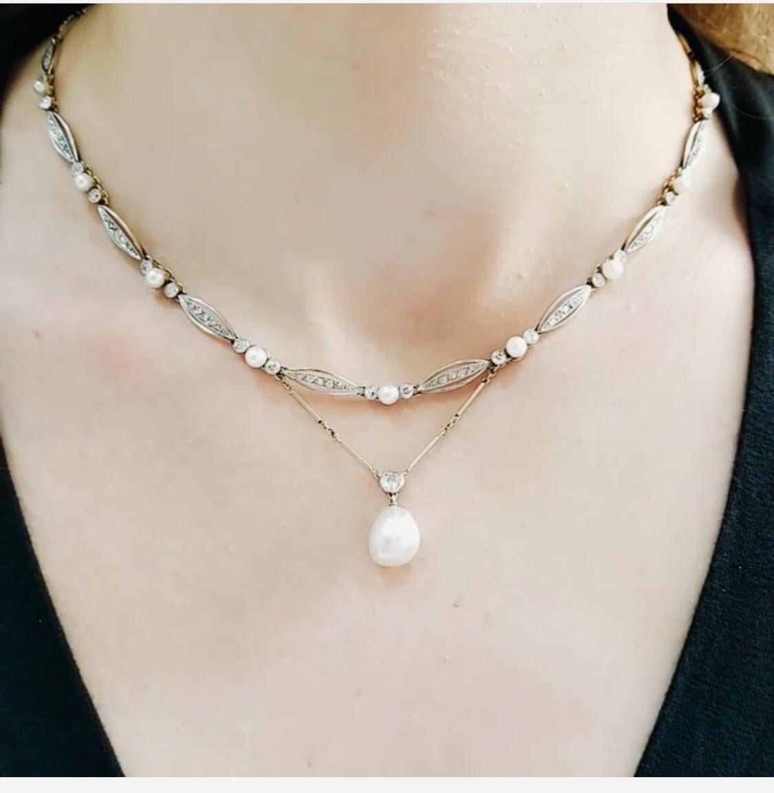 Vintage! G.I.A. Certified Salt Water Natural Pearl & Diamond Necklace!
Platinum sections encrusted with diamonds all the way with safety clasp
The front part of necklace has 9 section of  round pearl with 2 diamonds.
Drop has one large diamond