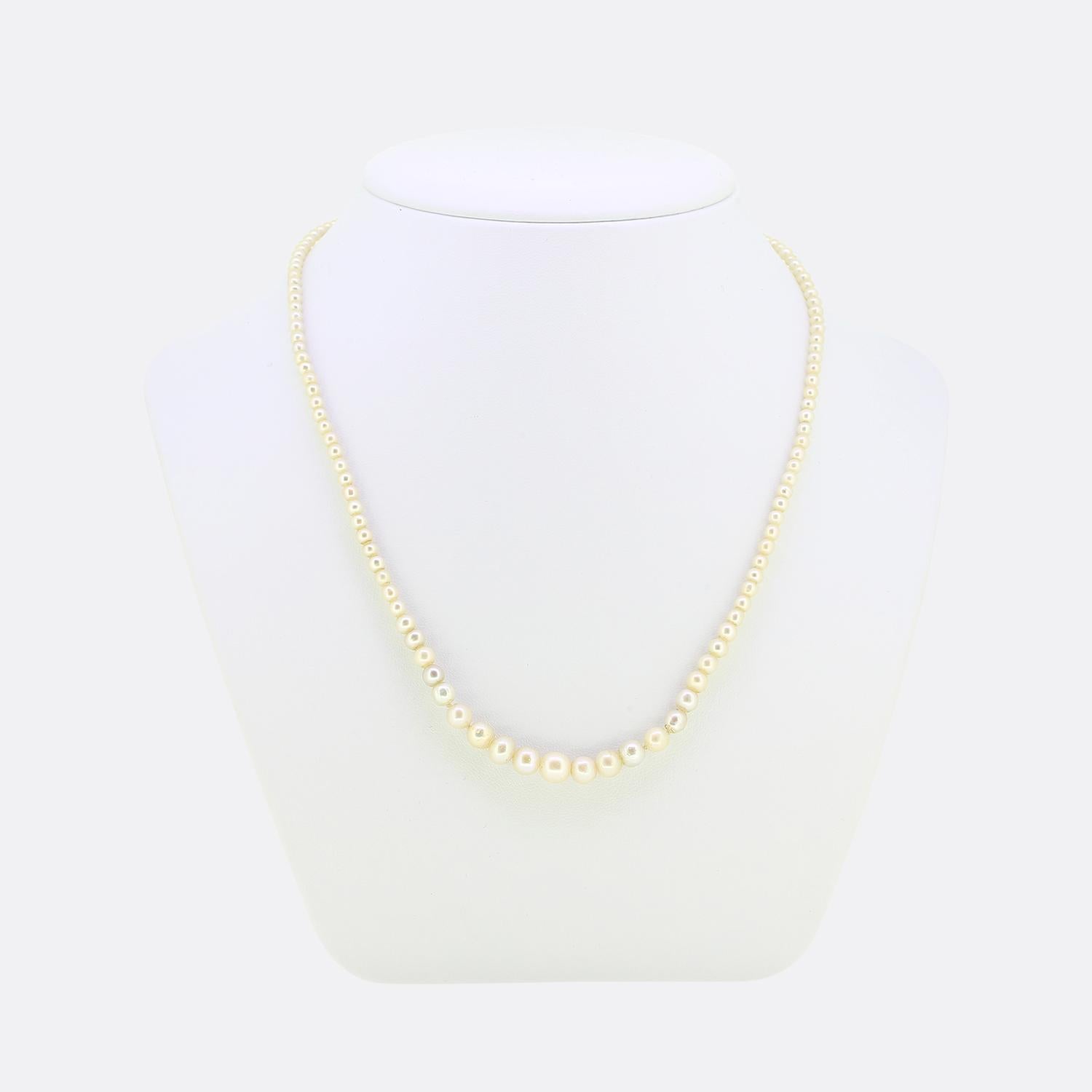 Here we have a delightful natural pearl necklace crafted at a time when the Art Deco style was at the height of design. This piece consists of single row of straight strung rounded, oval and baroque shaped saltwater pearls; all of which graduate in