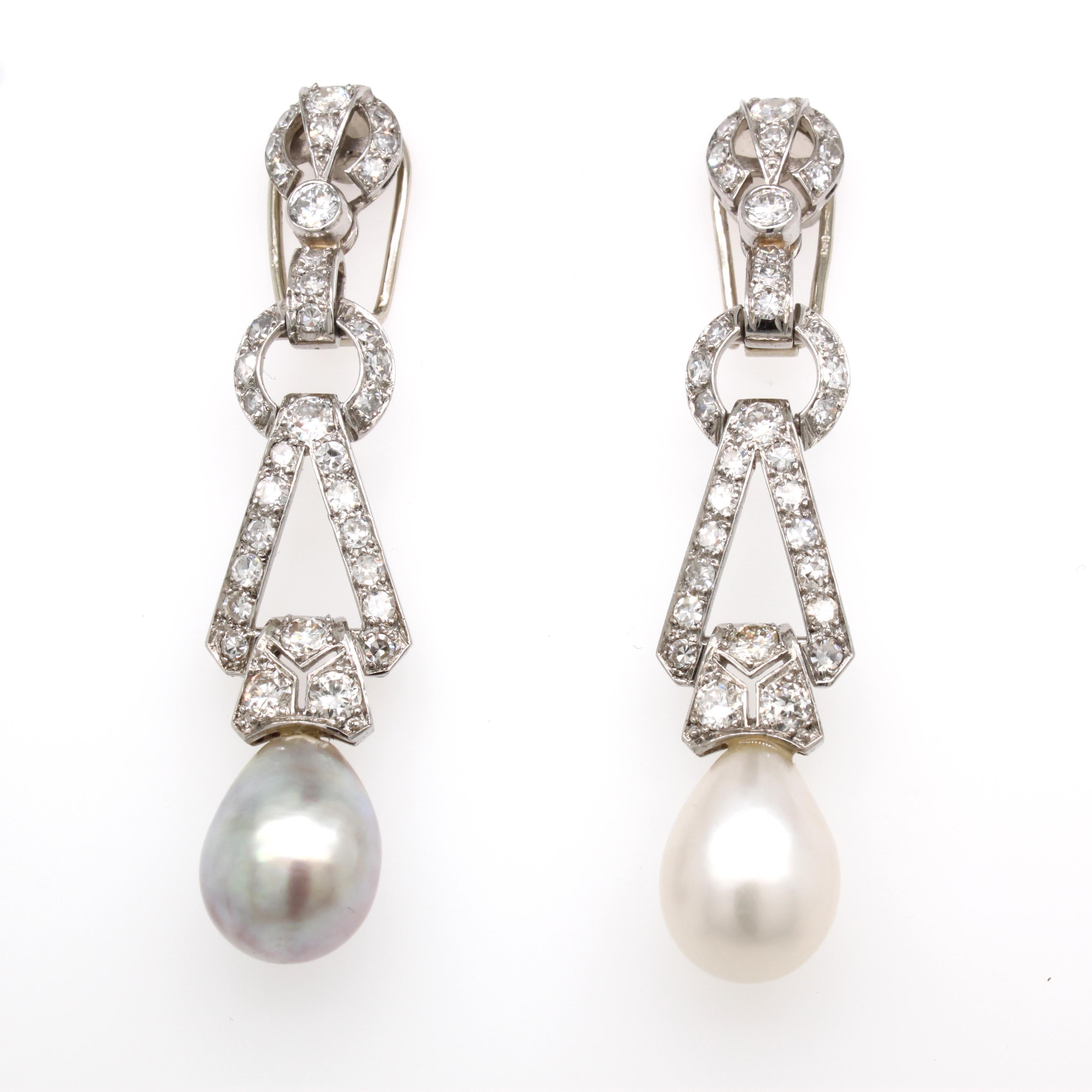 Art Deco Natural Saltwater Pearl and Diamond Earrings, ca. 1920s

A beautiful and very elegant pair of grey and white natural pearl and diamond earrings from the Art Deco period. The two natural saltwater pearl drops are of the finest quality