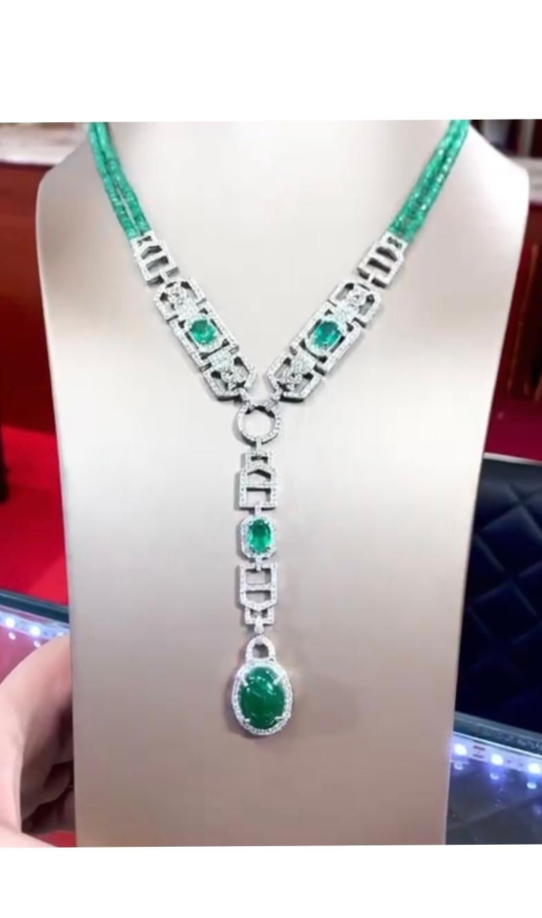 Amazing Art Deco design in 18k gold with this refined and chic necklace in 18k gold with four Zambia emeralds of 20,50 carats and round brilliant cut diamonds of 7,45 carats, F/VS.
Handcrafted by artisan goldsmith.
Excellent manufacture and