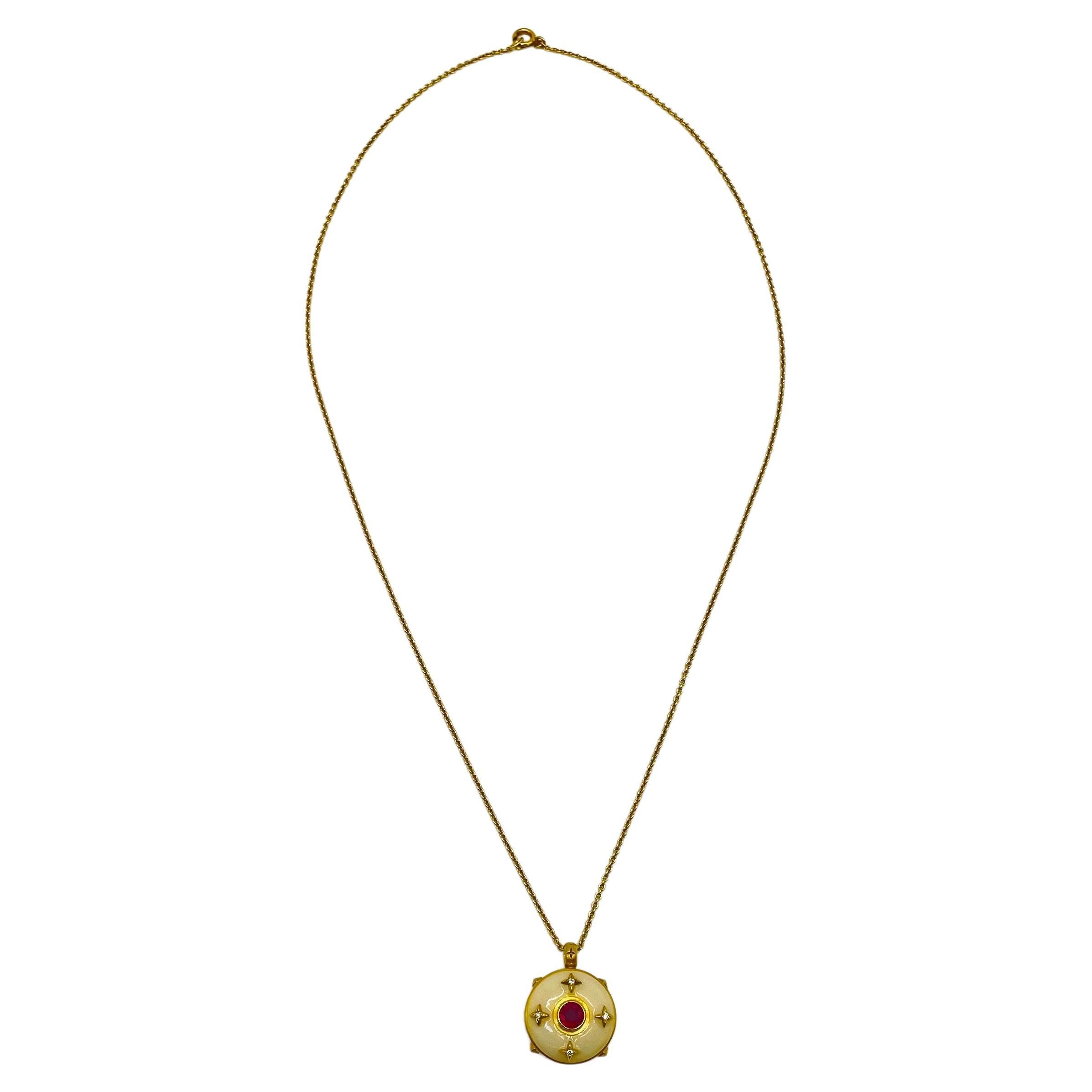 Indulge in the dreamlike allure of this exquisite 18k yellow gold necklace, an enchanting piece that radiates charm and sophistication. Adorning this beautiful necklace is a luscious red ruby, brilliantly cut in a captivating shape, accompanied by