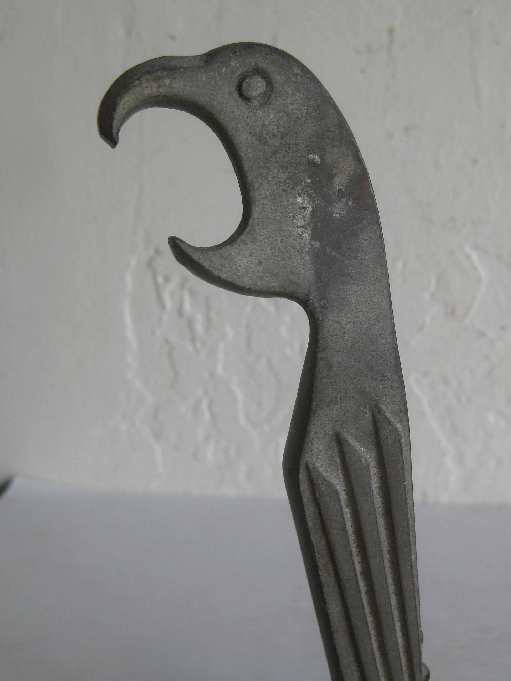 Great Art Deco figural parrot bird bar corkscrew bottle opener made by Negbaur and designed by Manuel Avillar, circa 1929. Appears it is made of bronze and has a silver painted finish. Some edge wear to the paint and is showing a bronze metal color.