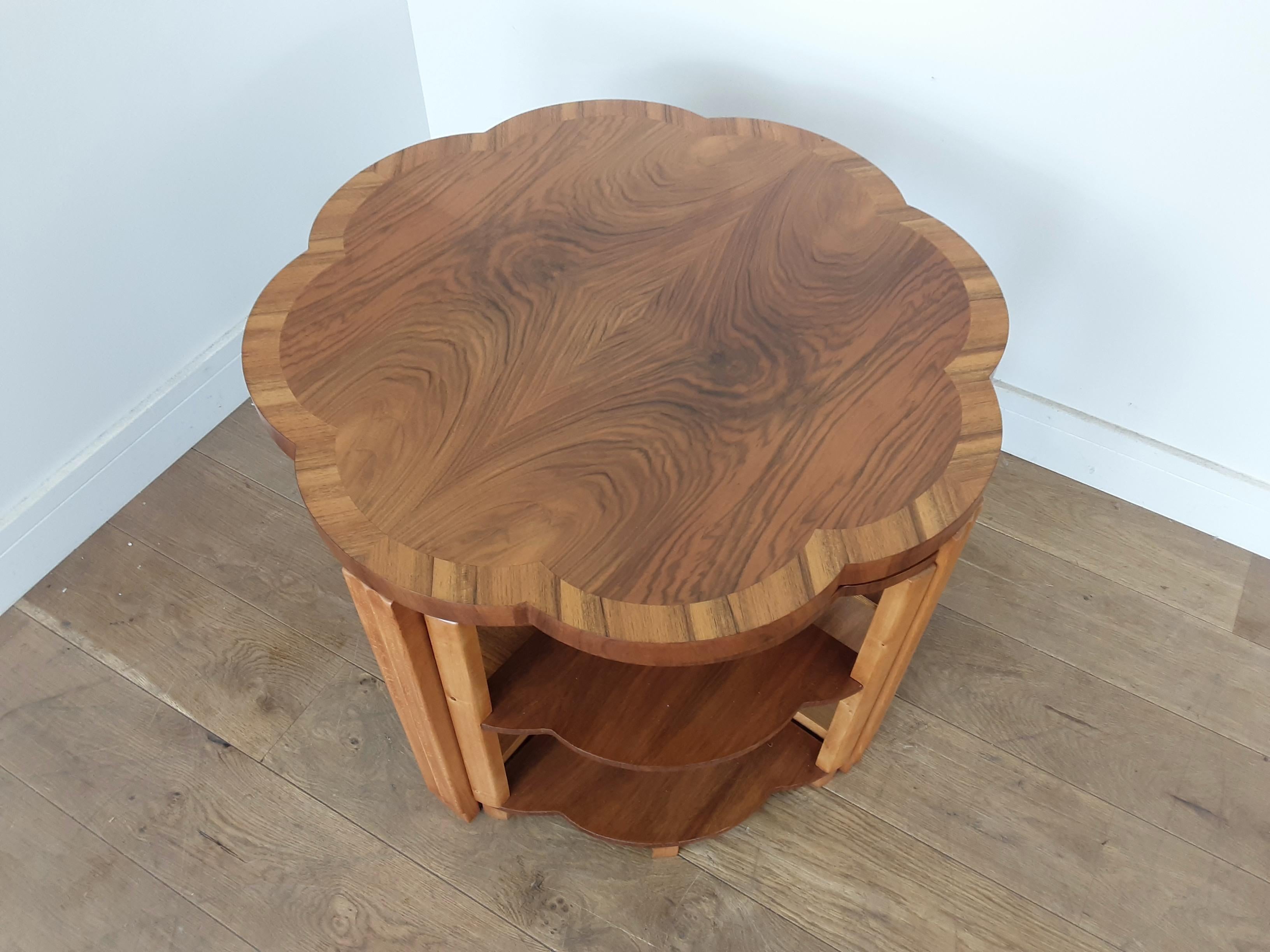 Art Deco quartet nest of tables.
Beautiful butterfly walnut table with a scalloped edge and four side tables which sit neatly underneath.
A Classic design by harry and Lou Epstein.
Measures: 56 cm height, 74 cm diameter, each side table is 50 cm