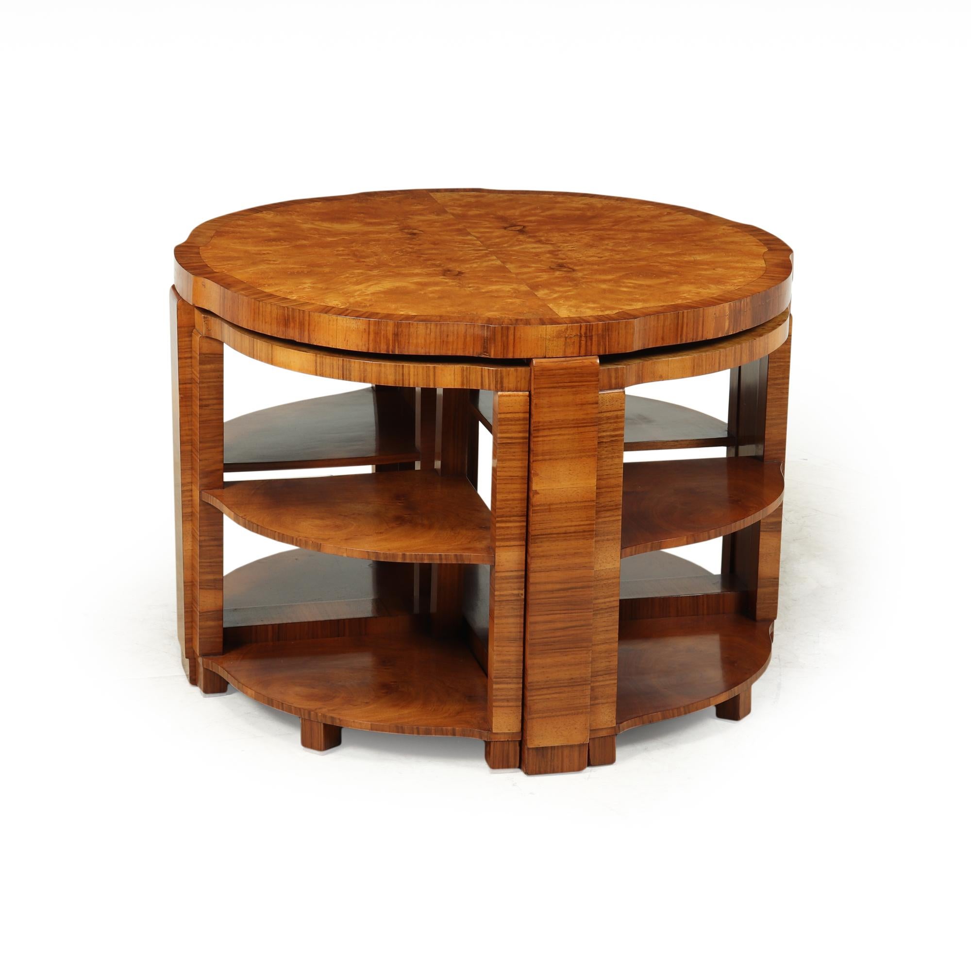 A very desirable nest of five tables produced in England in the 1930’s by Art Deco specialists workshops Epstien. This example is particularly special as it has burr maple tops with walnut cross banding. The tables are in excellent condition having