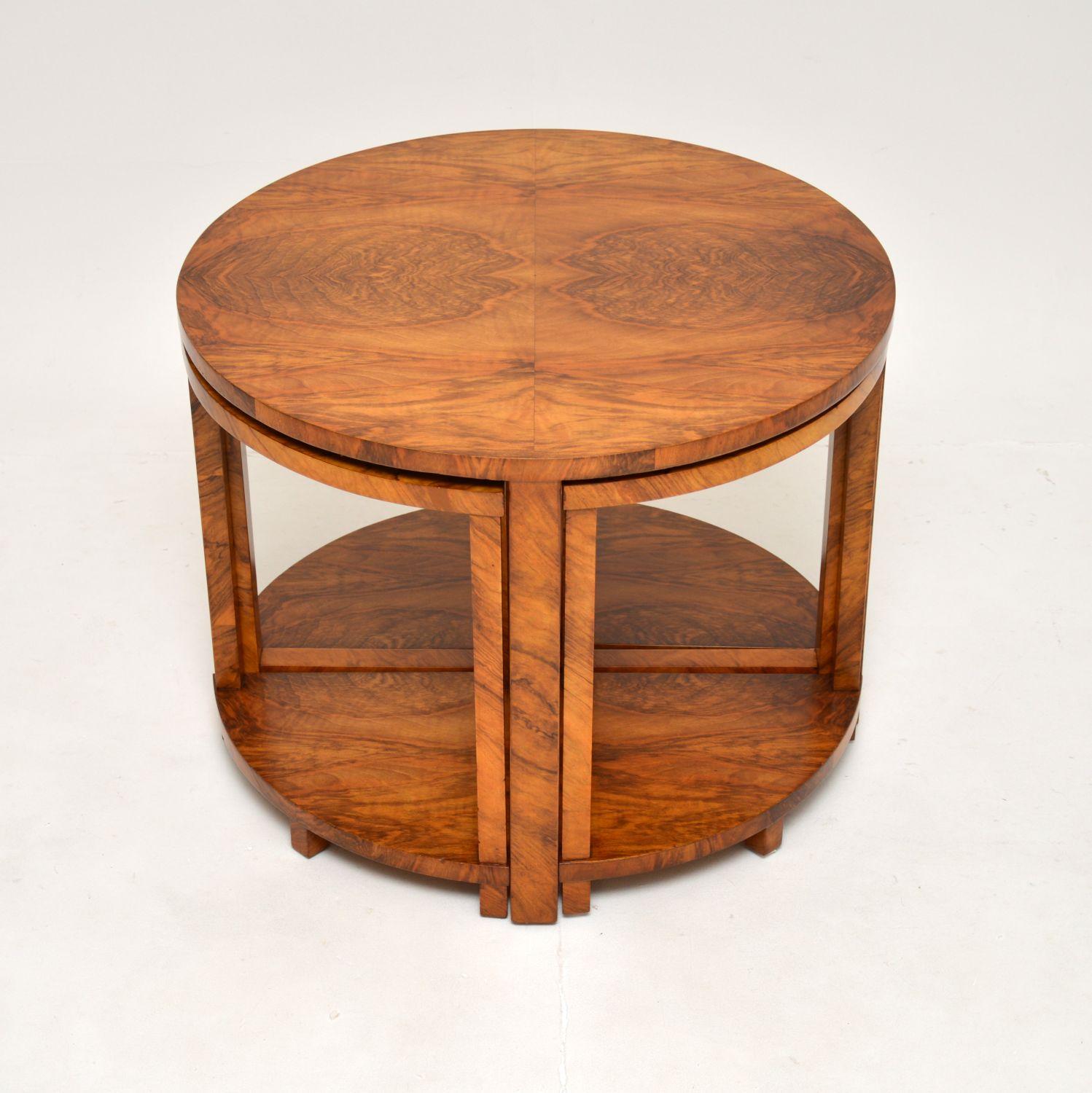 A stylish and extremely well made Art Deco nesting coffee table in walnut. This was made in England, it dates from the 1920’s.

The quality is outstanding, this has a gorgeous design and is very practical. The four smaller pie shaped tables nest
