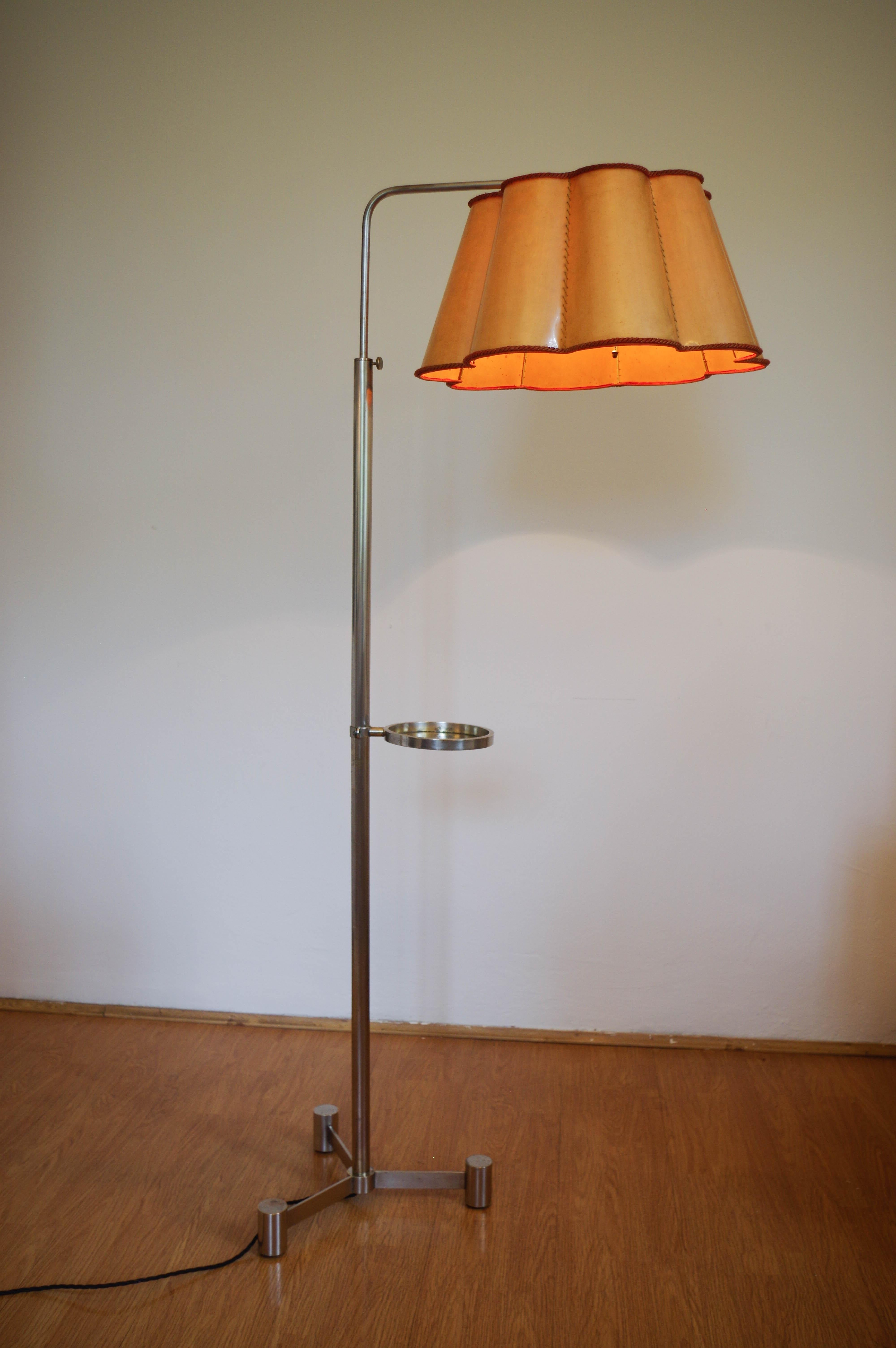 Simple and elegant nickel-plated floor lamp.
Adjustable height - 168cm - 190cm
Adjustable small round table.
Nickel plated tripod stand with age patina - cleaned and polished.
Original two-layer (paper and plastic) shade with no cracks.
Rewired: