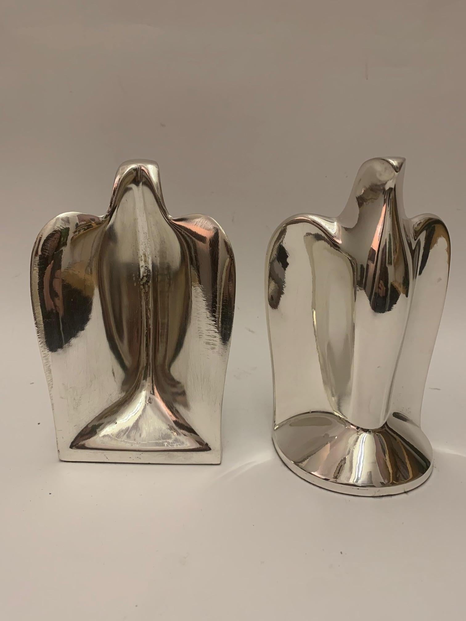 Art Deco nickel-plated bird bookends. Streamlined yet rectilinear, these abstract pair of Deco birds are the perfect compliment to any bookcase or desk.

Property from esteemed interior designer Juan Montoya. Juan Montoya is one of the most