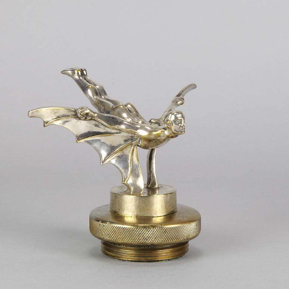 Dramatic early 20th century nickel-plated bronze Art Deco car mascot modelled as a flying ‘Batman’ with excellent color and detail, signed Sasportas and raised on original radiator cap

The Art Deco Period: although Art Deco derives its name from