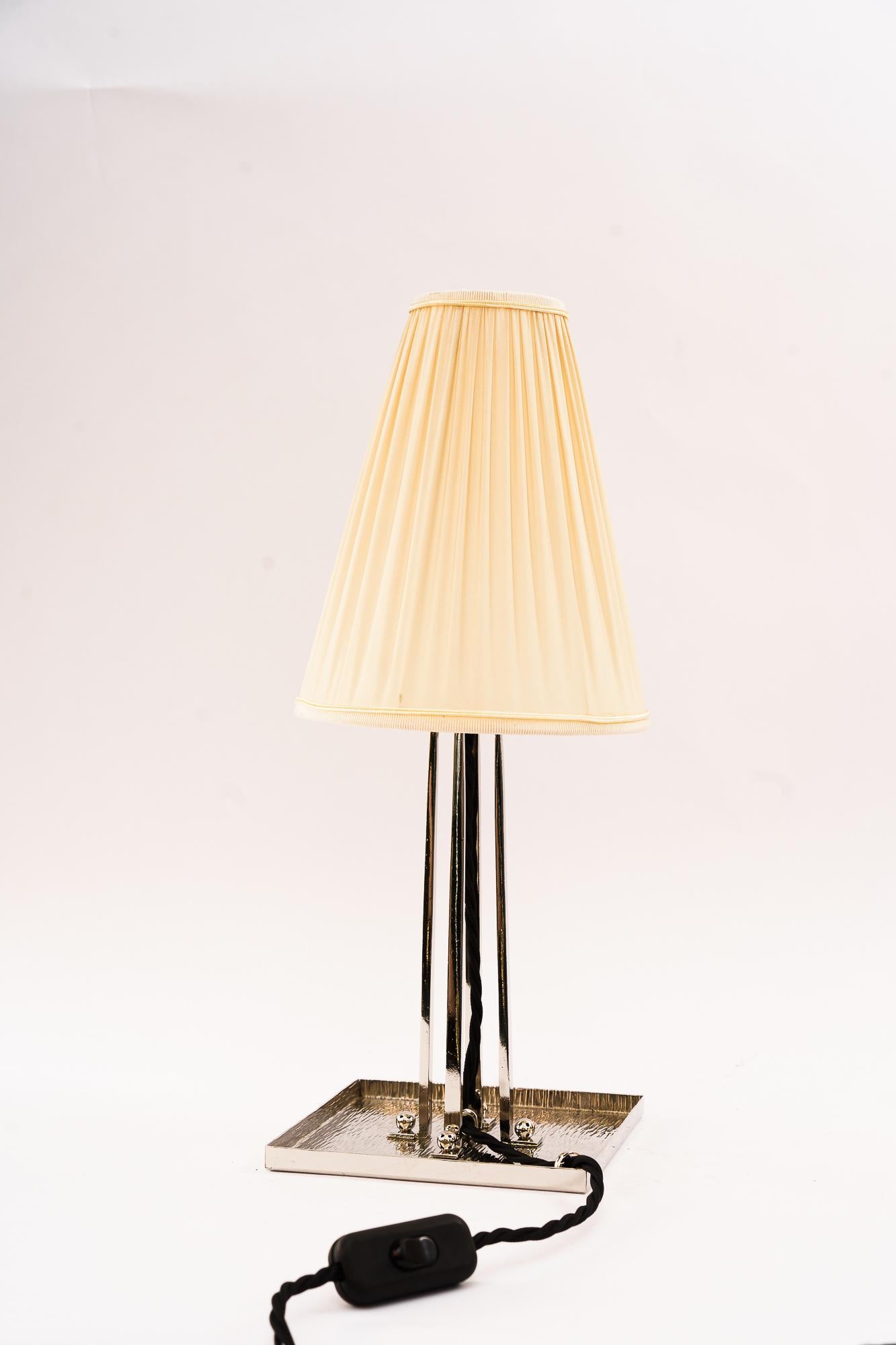 Art Deco nickel - plated table lamp with fabric shade around 1920s
Polished
