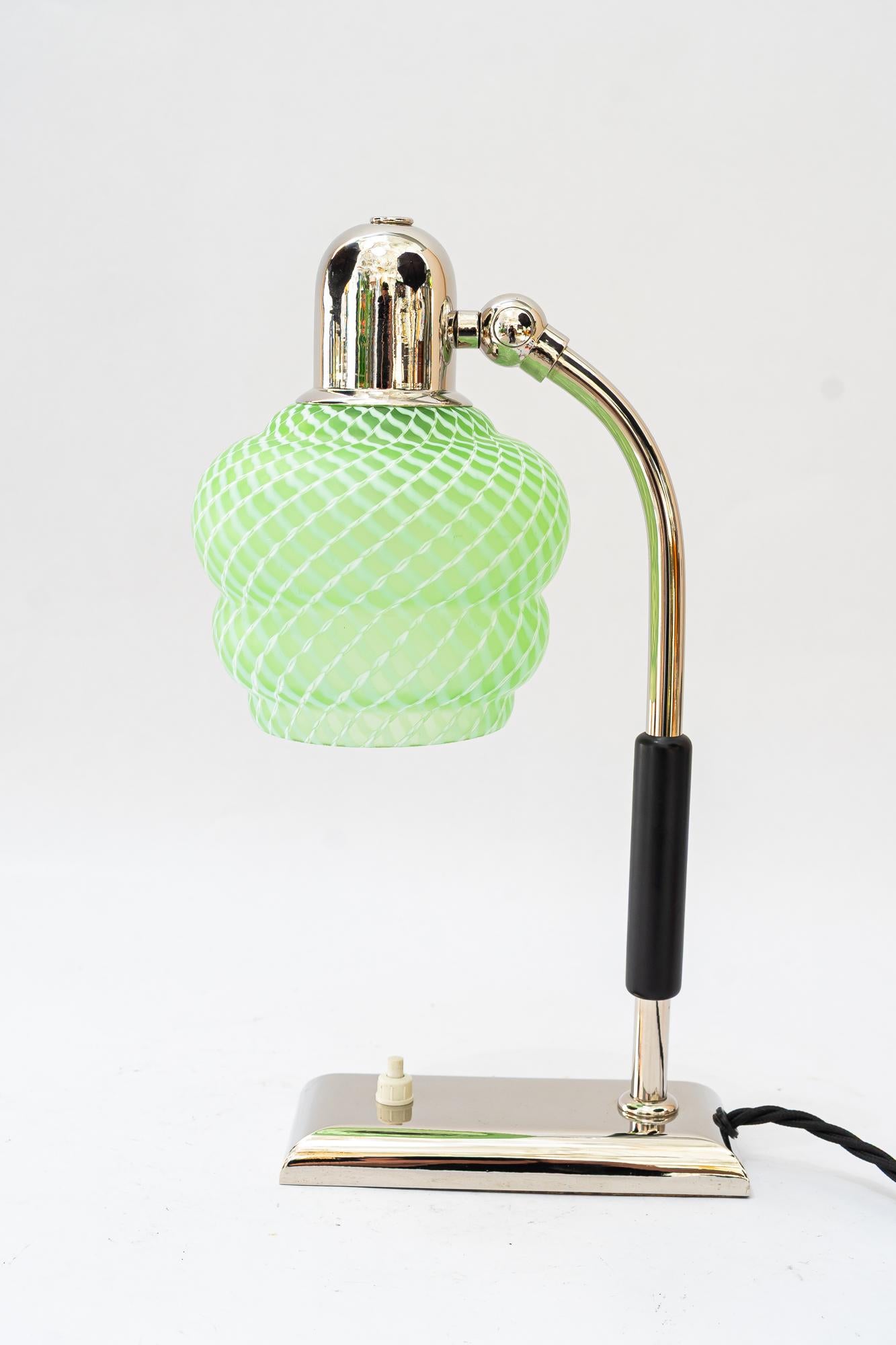 Swiveling Art Deco nickel - plated table lamp with orig. antique glass shade vienna 1920s
Wood handle is blackened.