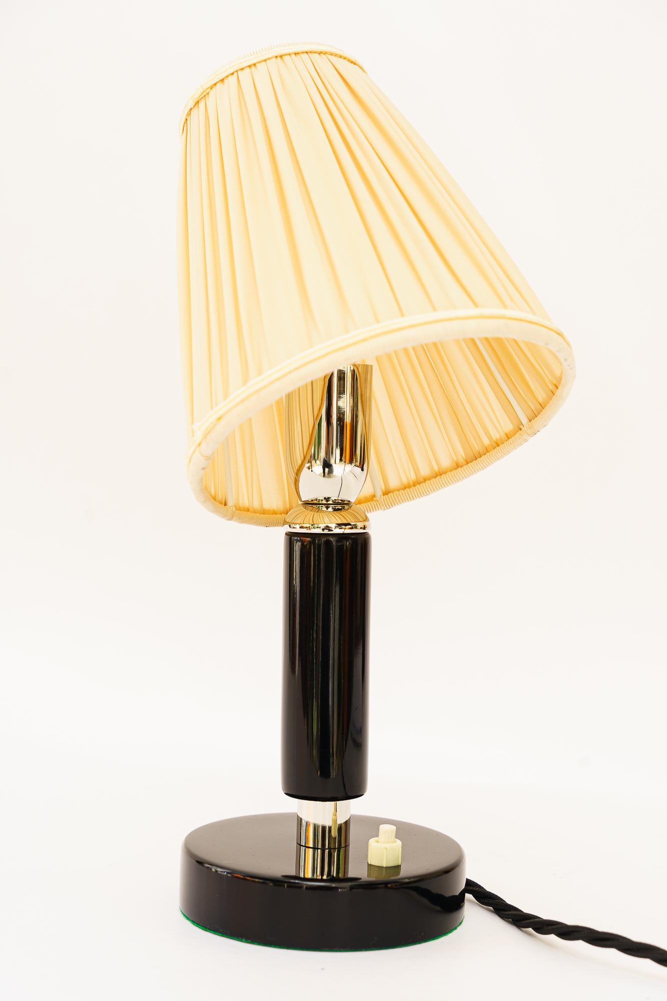 Blackened Art Deco nickel-plated wooden table lamp with fabric shade around 1920s For Sale