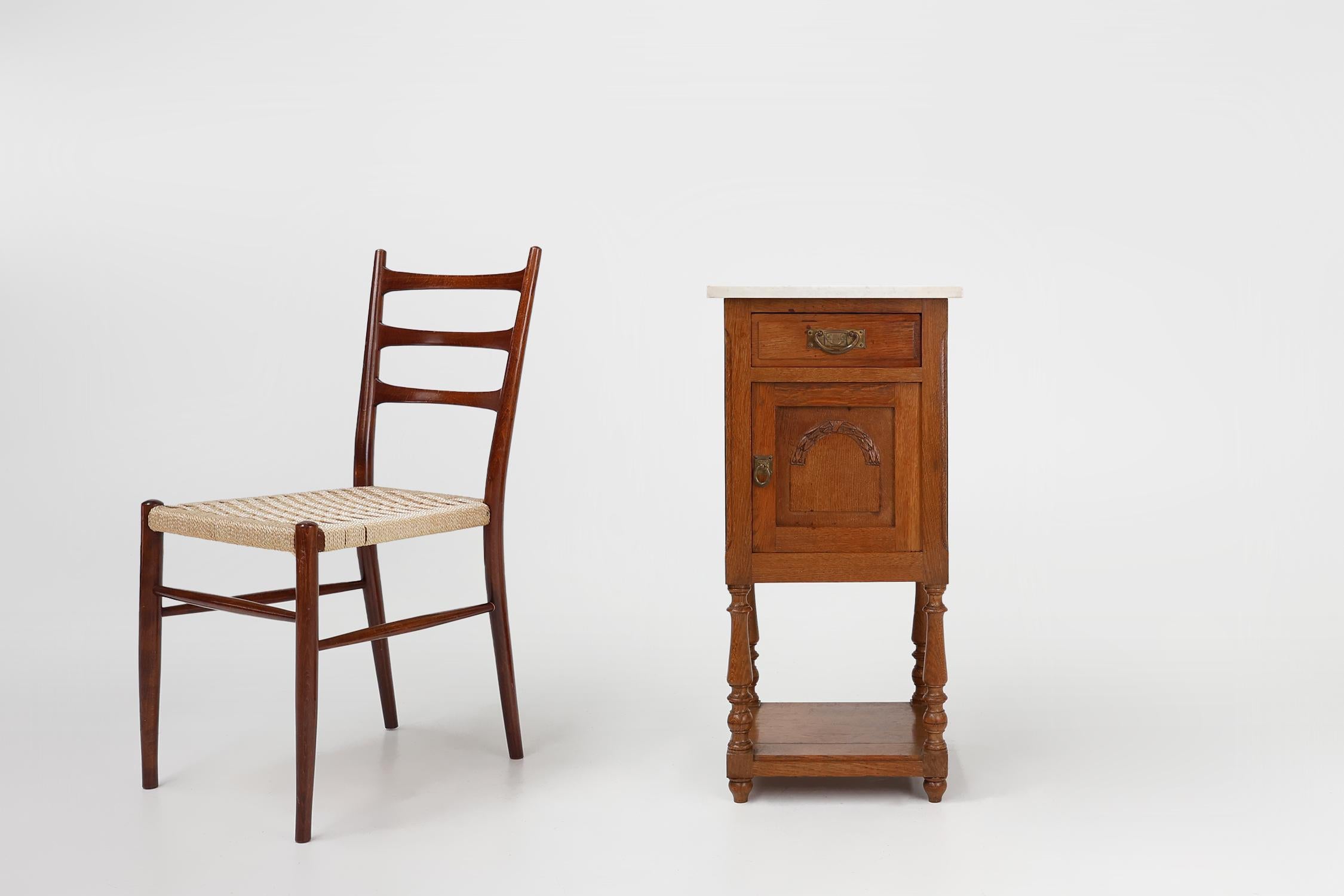 France / 1930 / nightstand / oak, Carrara marble / Art Deco / Mid-century

An exquisite Art Deco nightstand on graceful high legs in oak with carrara marble top. Crafted in France in the 1930s in full oak. With a drawer on top and a door underneath.