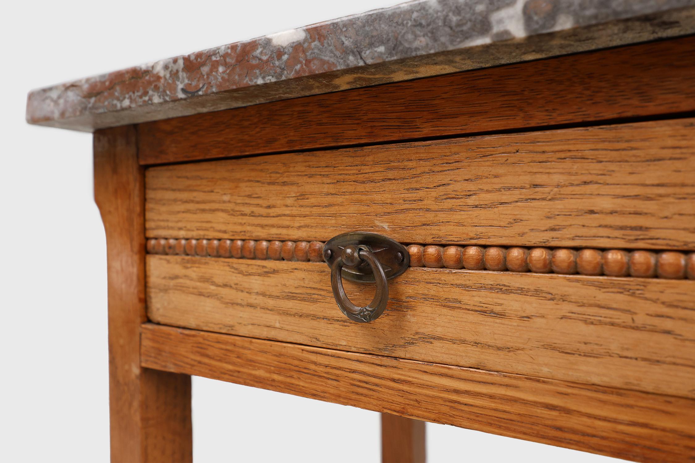 Hand-Carved Art Deco nightstand in oak with pink marble top, France ca. 1930 For Sale