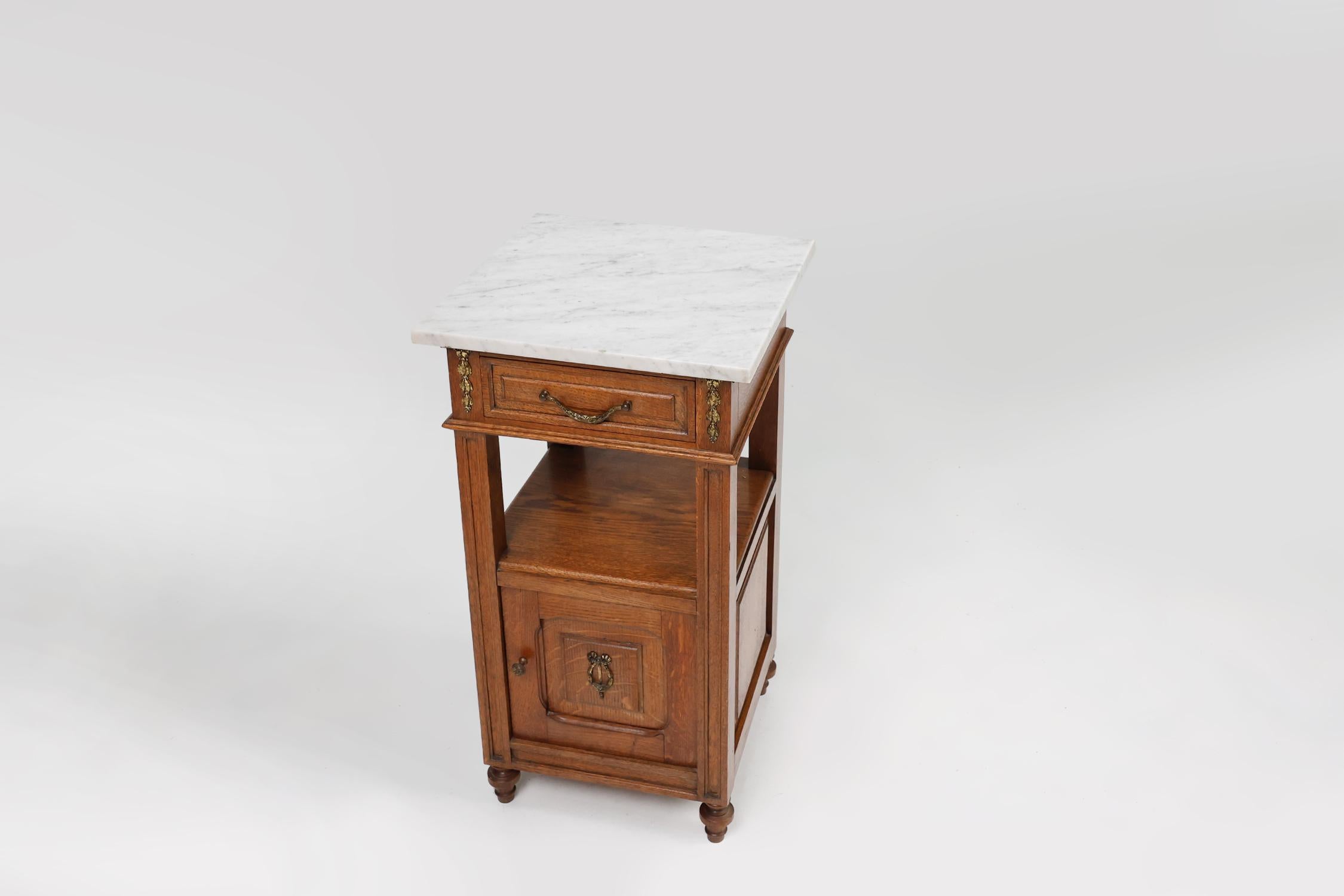 Bronze Art Deco nightstand with a Carrara marble top, France ca. 1910 For Sale