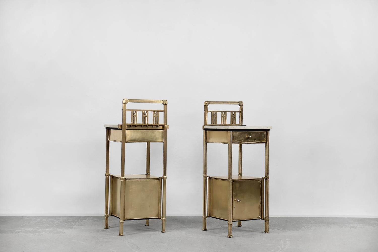 This set of two rare bedside tables was manufactured in Warsaw by the famous Polish factory - 'Zaklad Wyrobów Metalowych Konrad, Jarnuszkiewicz i S-ka'. This set was created at the turn of the 19th and 20th centuries. They are made of solid brass