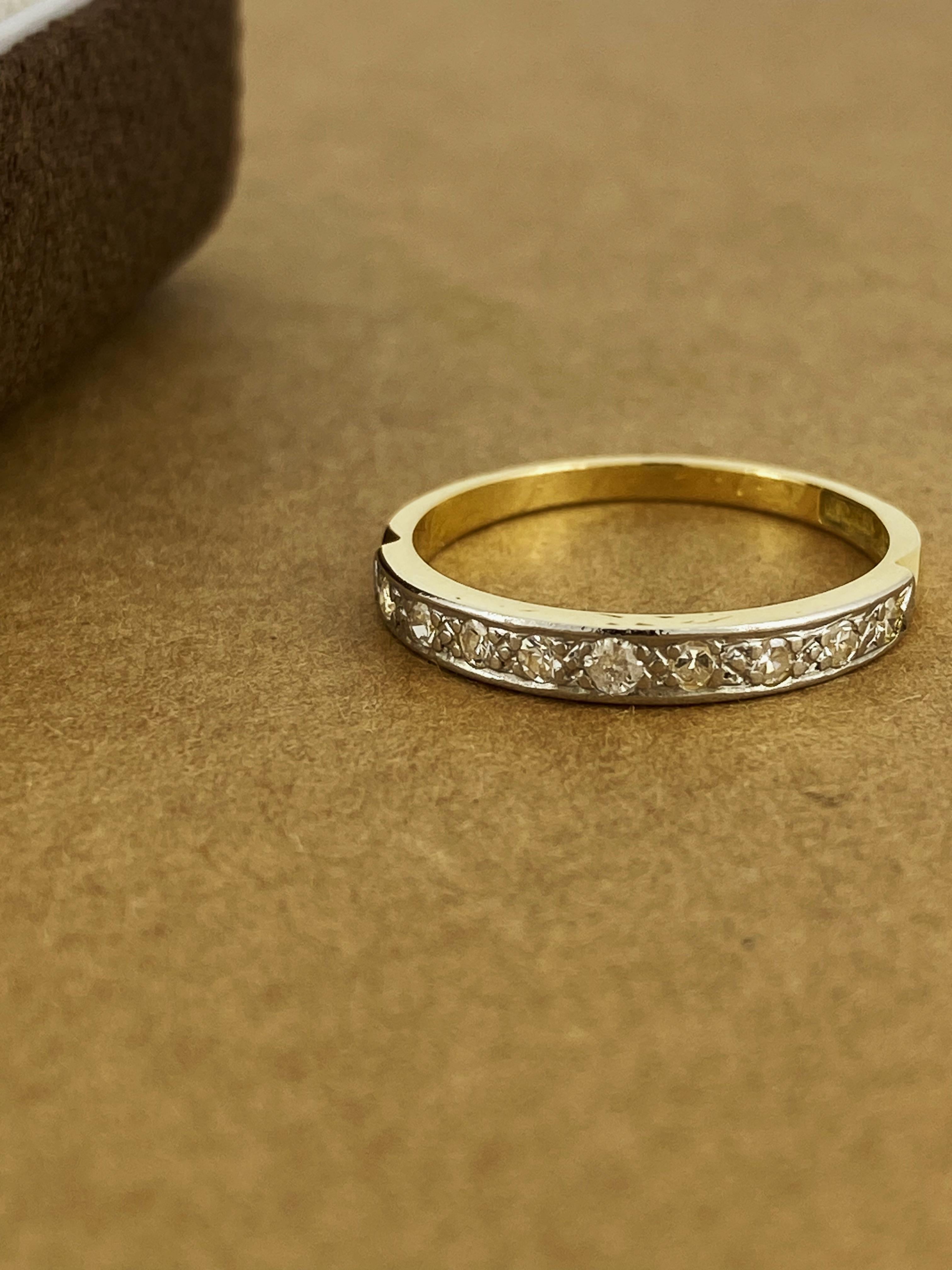 This exquisitely crafted original Art-Deco 1930’s band 
is grain set in platinum with 9 Rose Cut Diamonds 
of good colour & clarity, totalling 0.25ct approx. 

The band is performed in 18K yellow gold, 
dainty & well-proportioned it measures 2.5 –