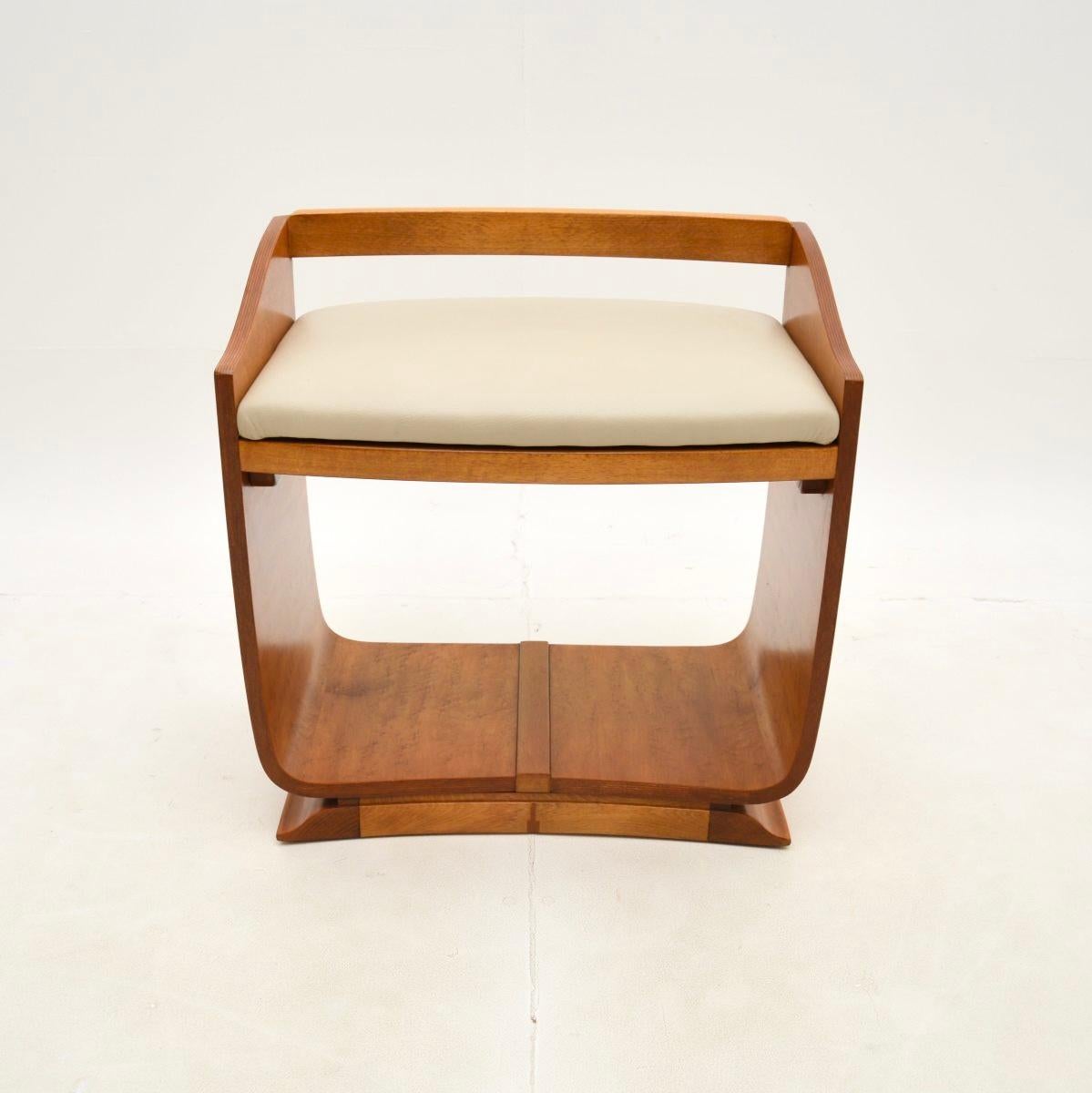 A very stylish and extremely well made Art Deco Norwegian elm and leather stool. This was made in England, it dates from the 1930’s.

It is a useful and beautiful item, the U shaped frame has gorgeous grain patterns and is nicely finished on all