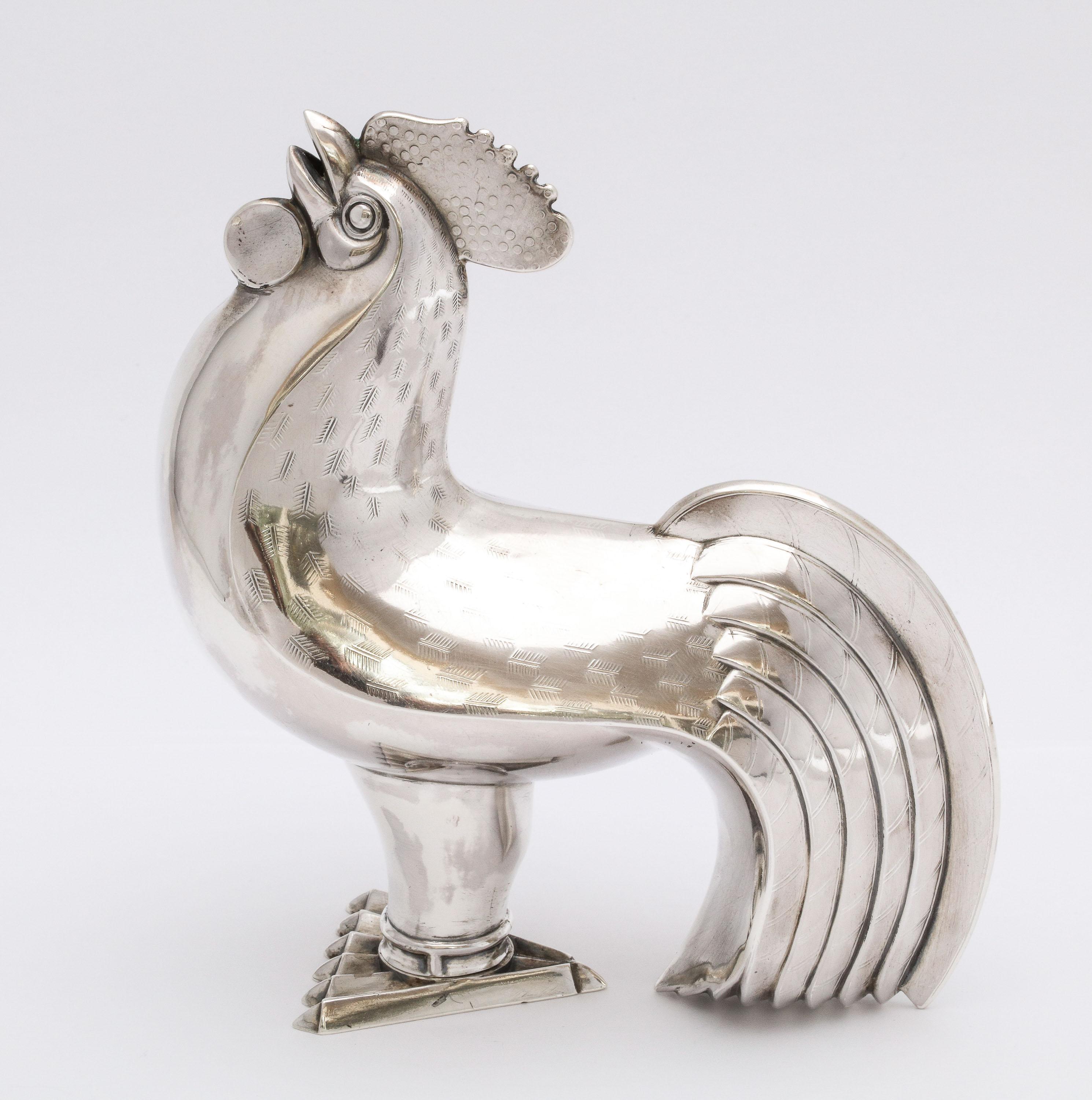 Art Deco, sterling silver, rooster-form sugar caster. Norway, J. Tostrup - maker. Remove the feet to fill the caster and pour sugar through the mouth. Feet opening and closure mechanism is bayonet in design. Measures: 5 1/2 inches high x 5 inches