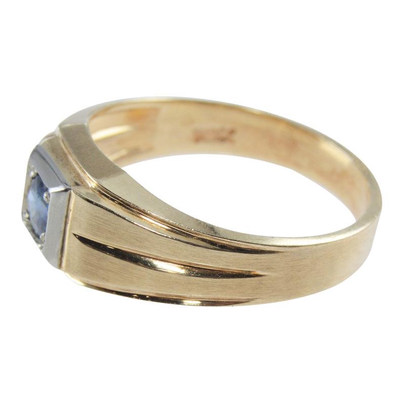 New Old Stock Art Deco Ring crafted in 10Kt Solid Yellow Gold with a round Blue Stone Center. This Classic 1930's ring has a strong architectural Art Deco style and is in Perfect condition. It is currently Size 9.5 and easily sized to fit you. This