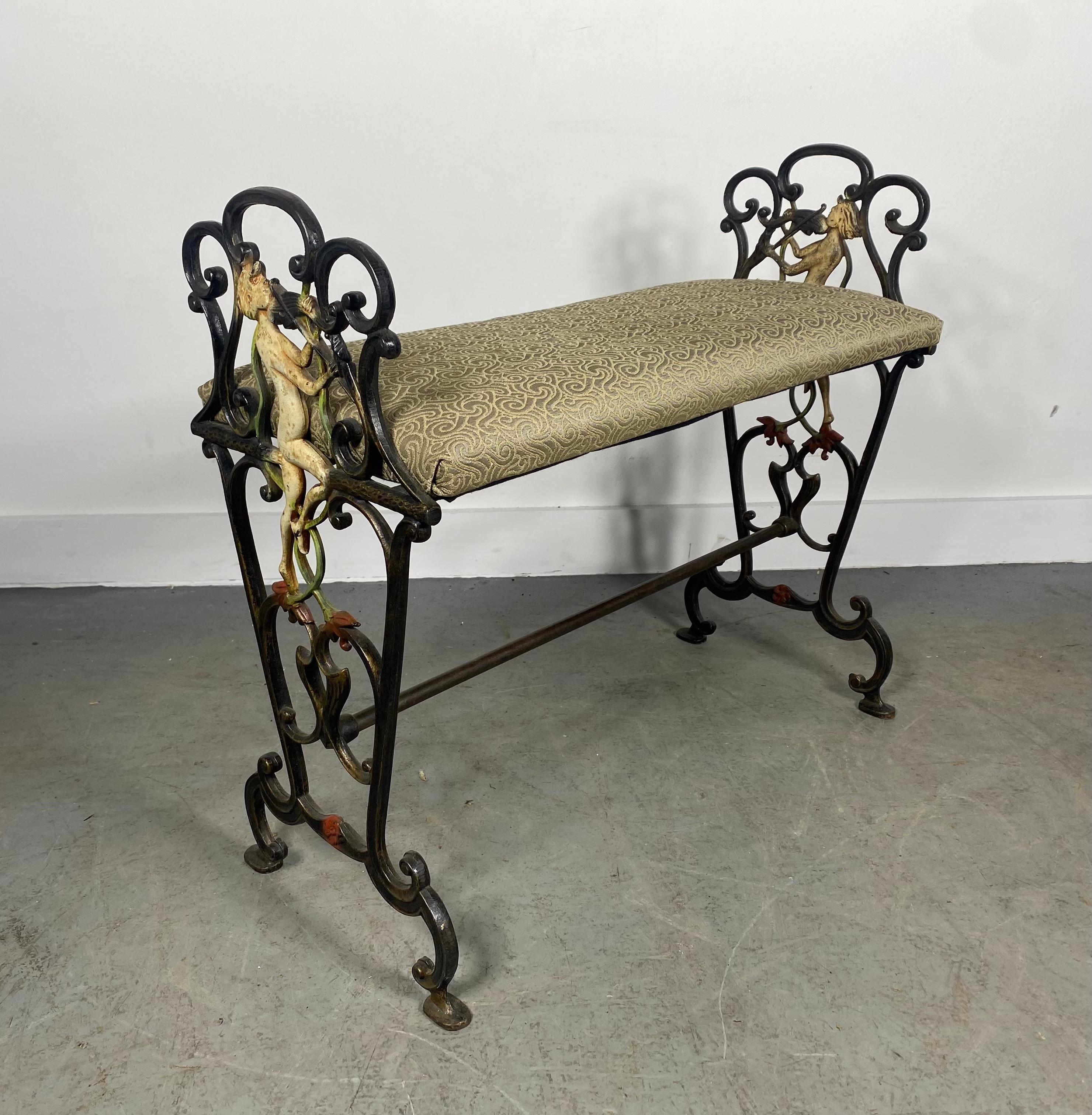 Charming and unusual Art Deco / Art Nouveau Cast Iron Bench, Wonderfully decorated and casted,,featuring almost mythological greek Figural Violinist Motif.. appears to be hand painted? Retains reupholstered fabric seat.