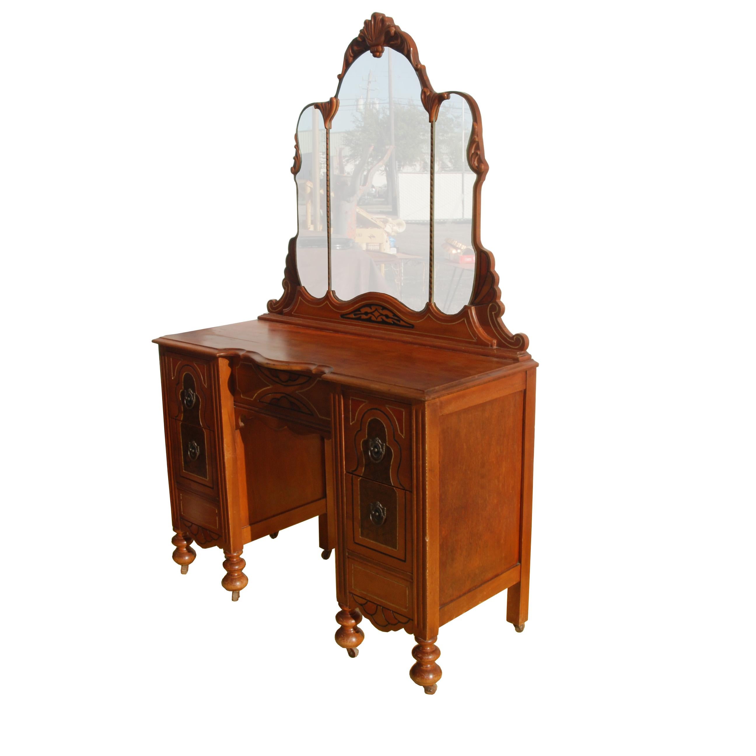 Art Deco/Nouveau waterfall vanity with drawers

Stunning vanity from 1920s-1930s Art Deco/Nouveau period.
Features intricate detailing throughout vanity, and ornate carvings on mirror frame. Could be used as a small writing desk if