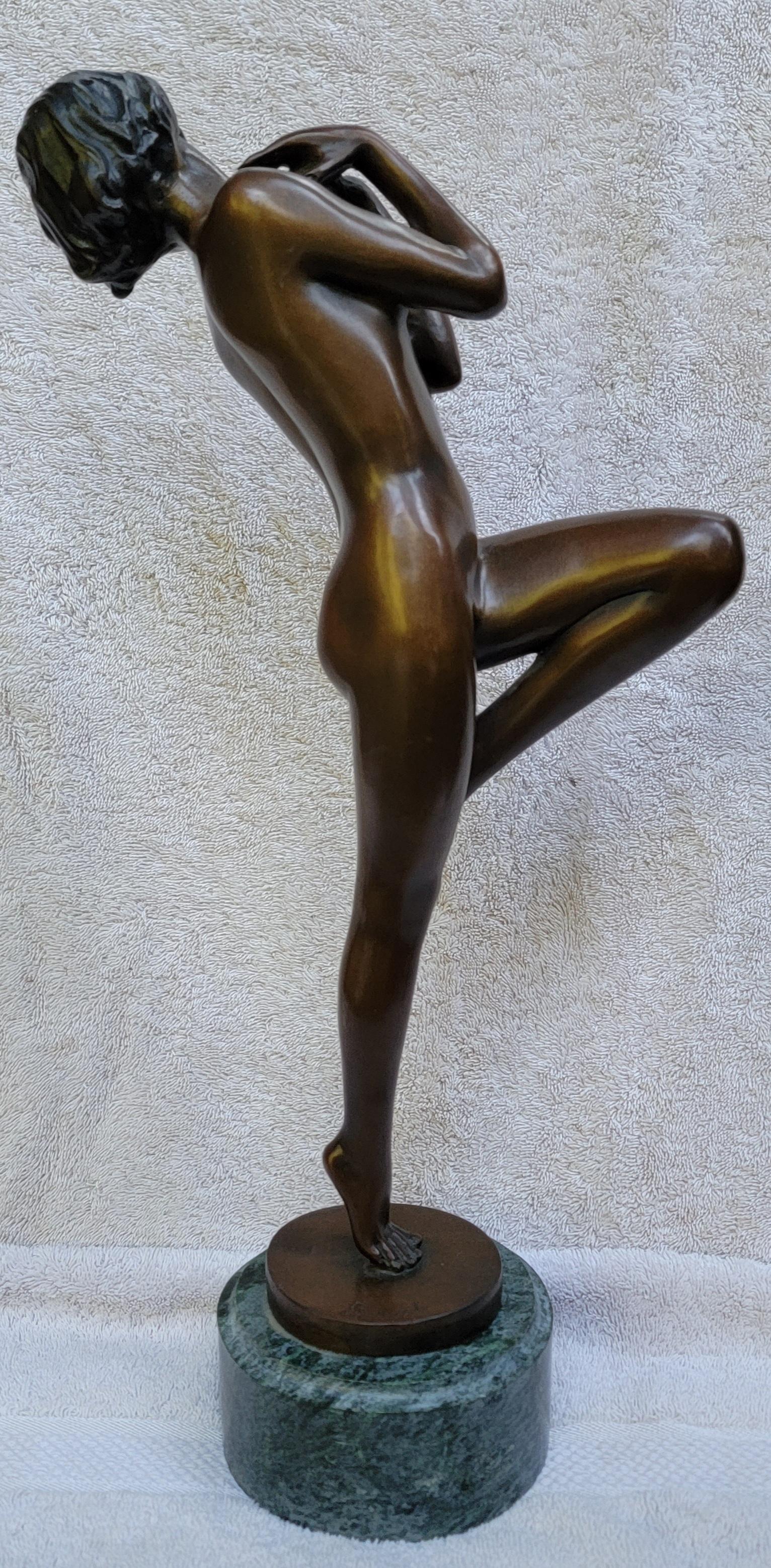 Art Deco bronze sculpture mounted to marble base. Signed Lorenzl at base with Lorenz brass tag on marble. Solid bronze. Posing nude woman standing with one leg raised and hands raised to chest. Medium scale, stands 17.13 inches tall. I believe this