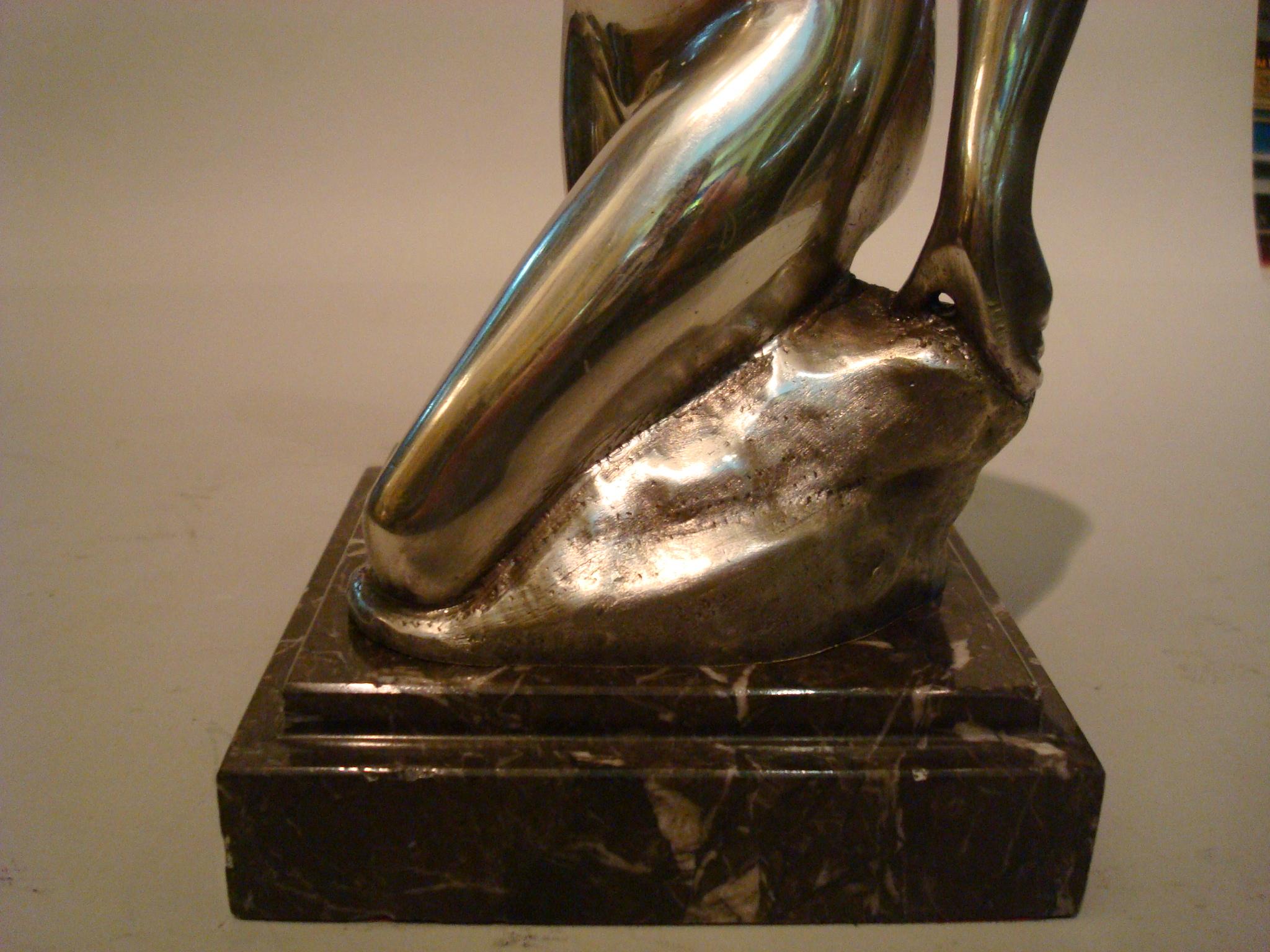 Art Deco figure of a nude woman. Made of bronze. Erotic sculpture. Very nice midcentury table item. Mounted over a marble base. Very good conditions.
Signed J. Garnier.
 