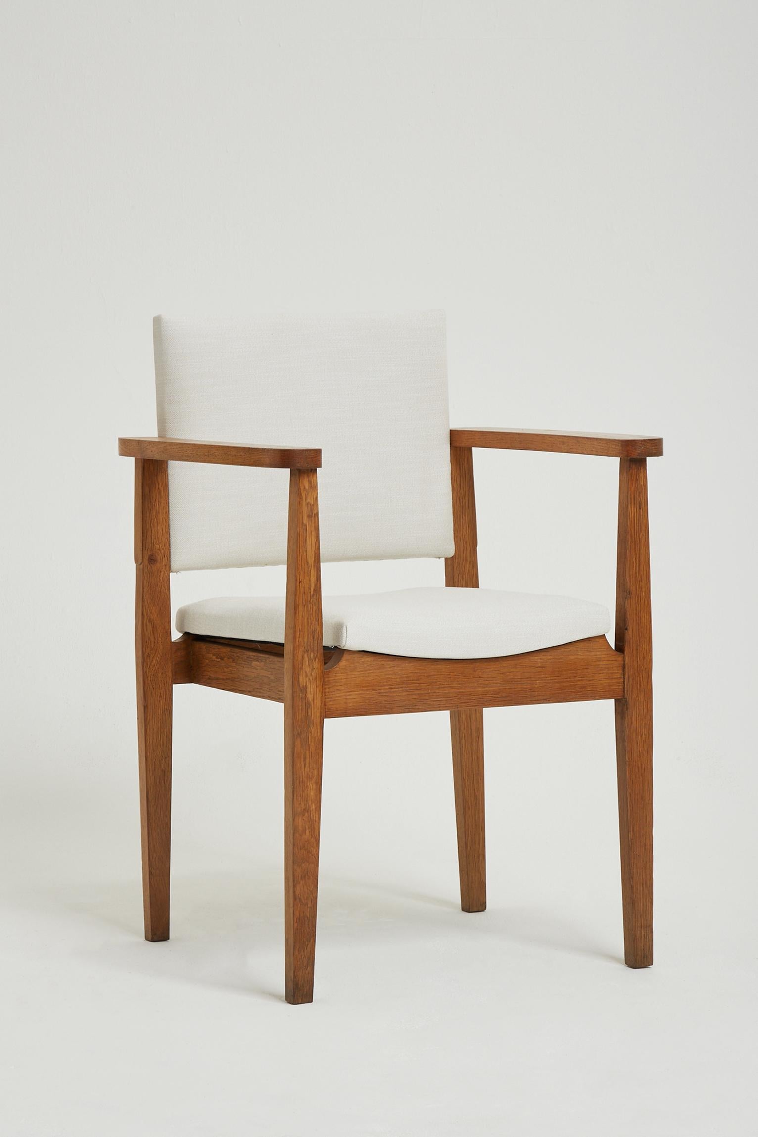 A solid oak armchair.
France, Circa 1940.