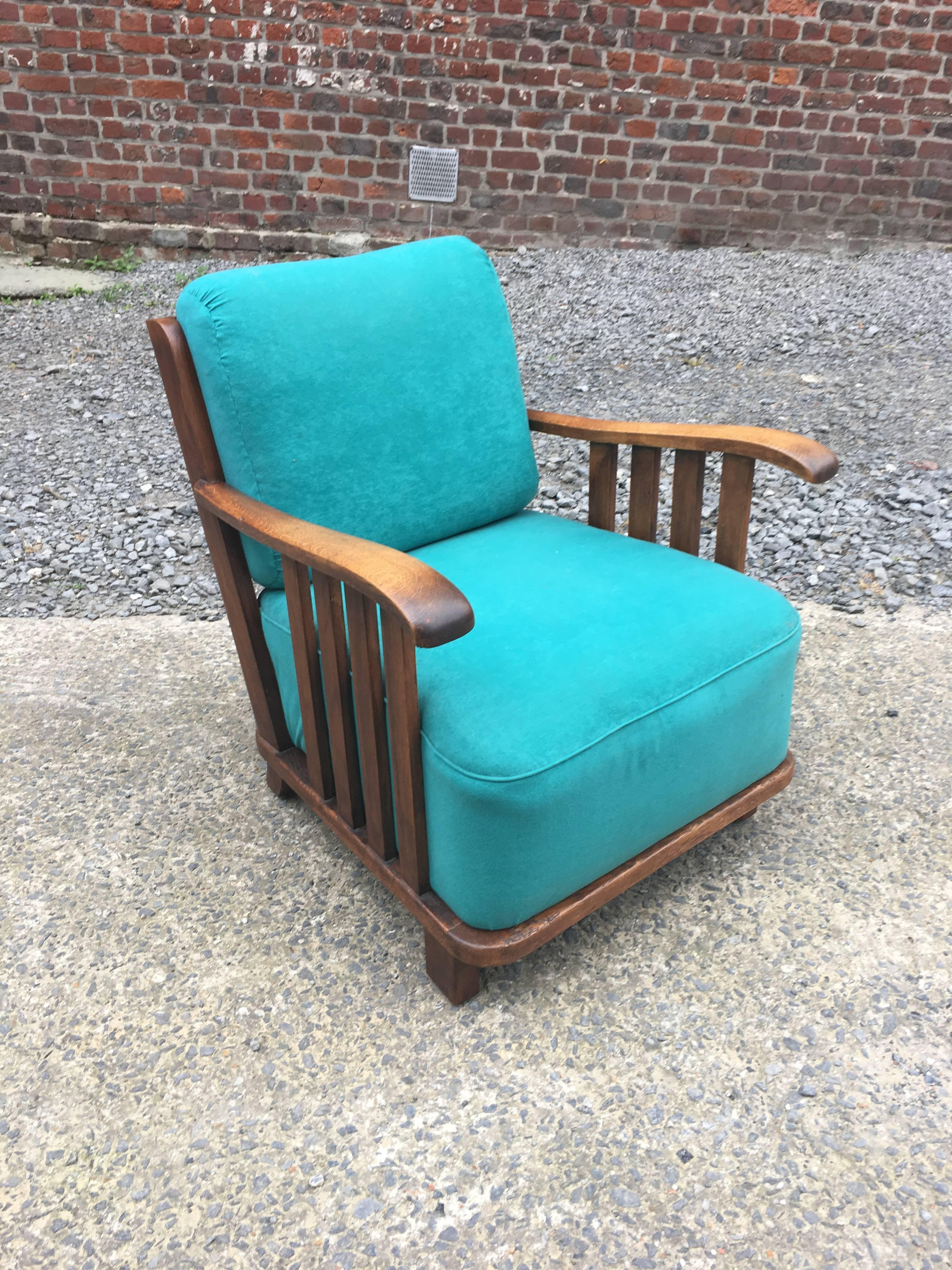 Art Deco oak armchair in the style of Maxime Old, circa 1940.