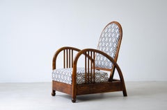Art Deco oak armchair with curved armrests