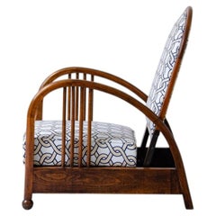 Art Deco oak armchair with curved armrests