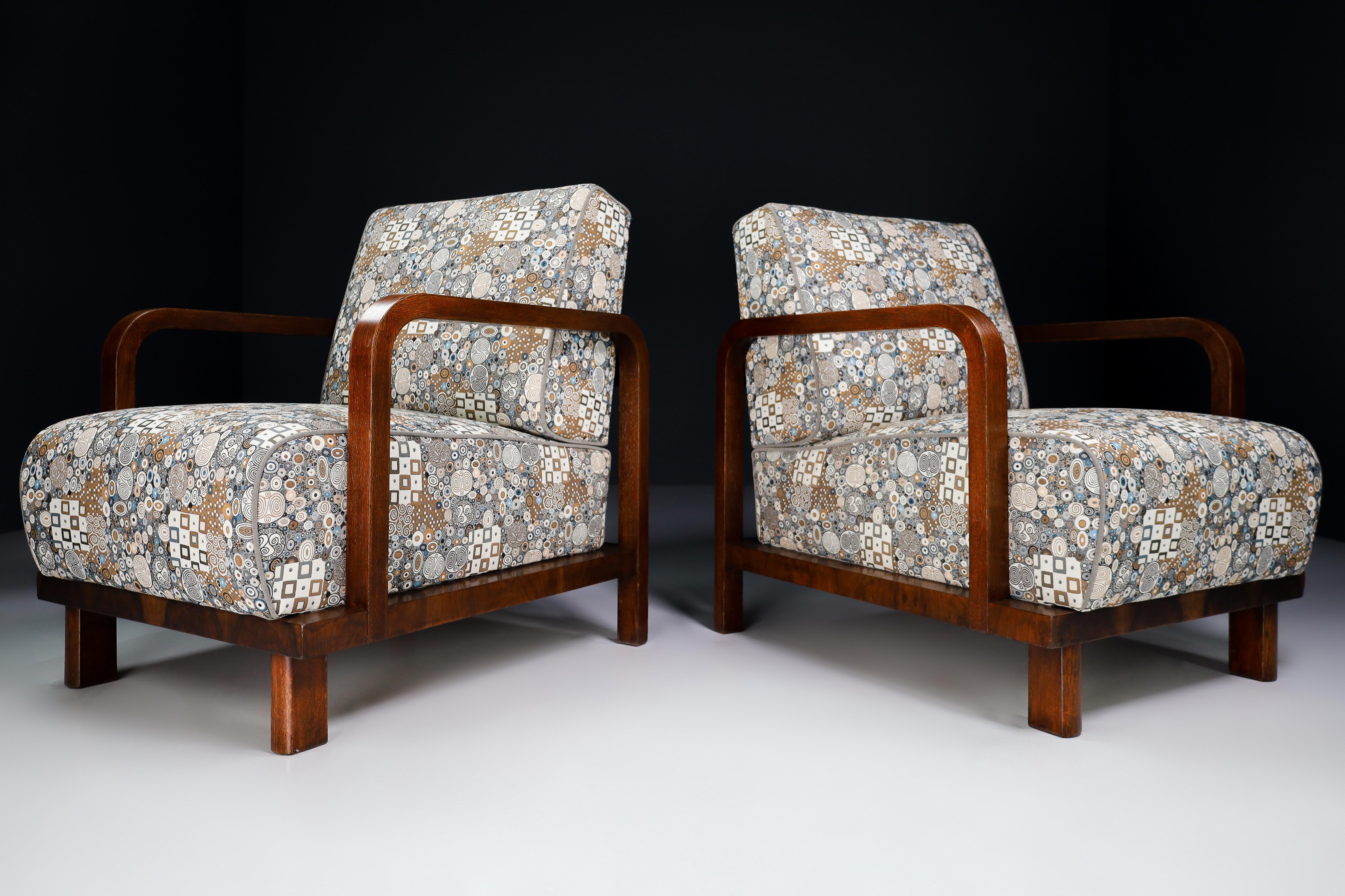 Pair of two Art-Deco lounge / arm chairs, in Oak Bentwood and Re-upholstered fabric, France, 1930s. These armchairs would make an eye-catching addition to any interior such as living room, family room, screening room or even in the office. It also