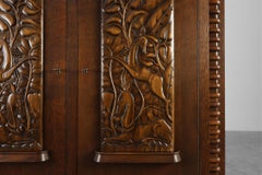 Art Deco Oak Cabinet with Sculptural Carving by Jacques Klein, France 1925