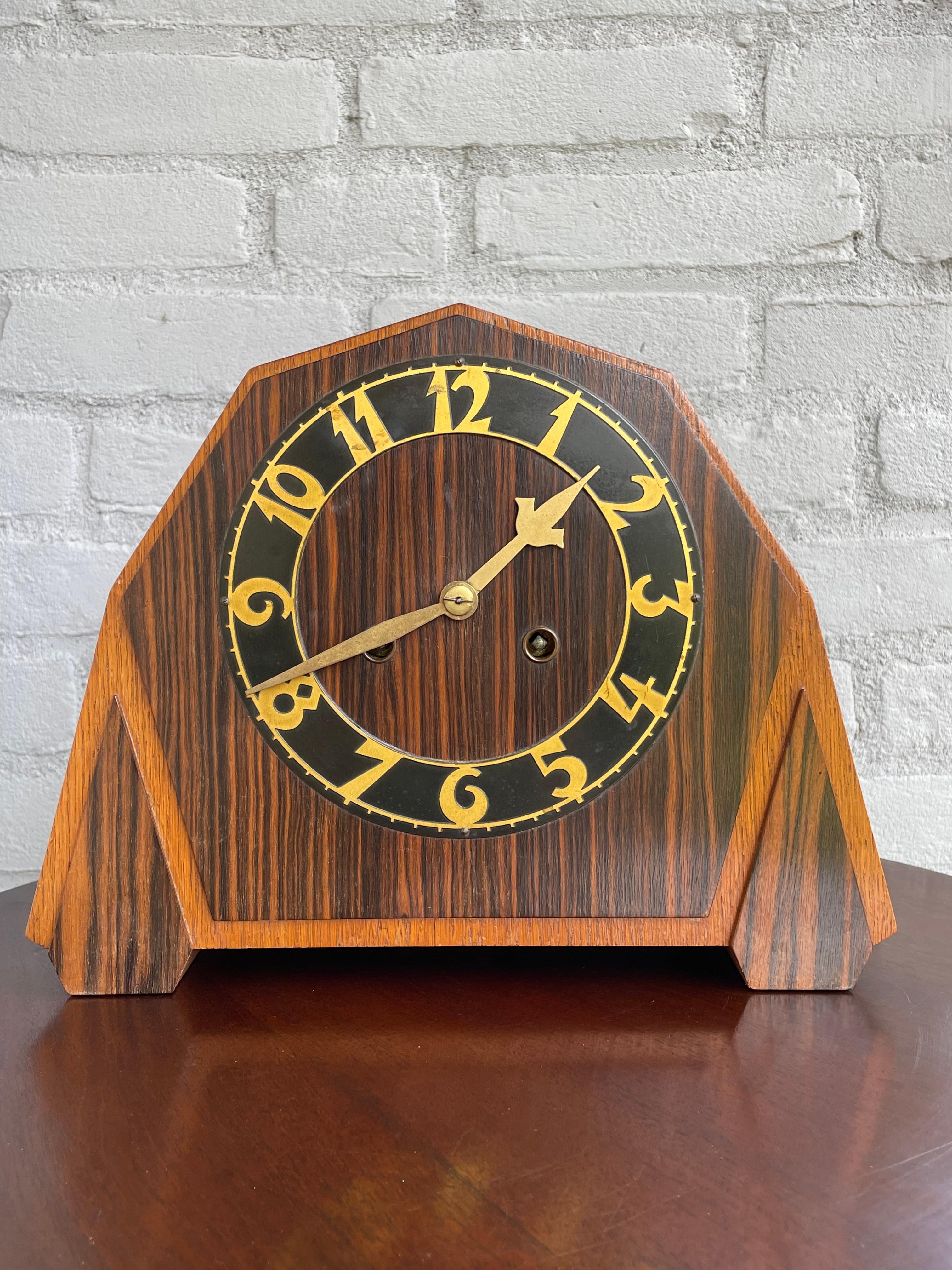 Beautiful design and perfectly working, Dutch Art Deco clock.

If you are looking for a great design and excellent condition clock then this original Art Deco specimen from the 1920s could be perfect. The combination of the darker coromandel