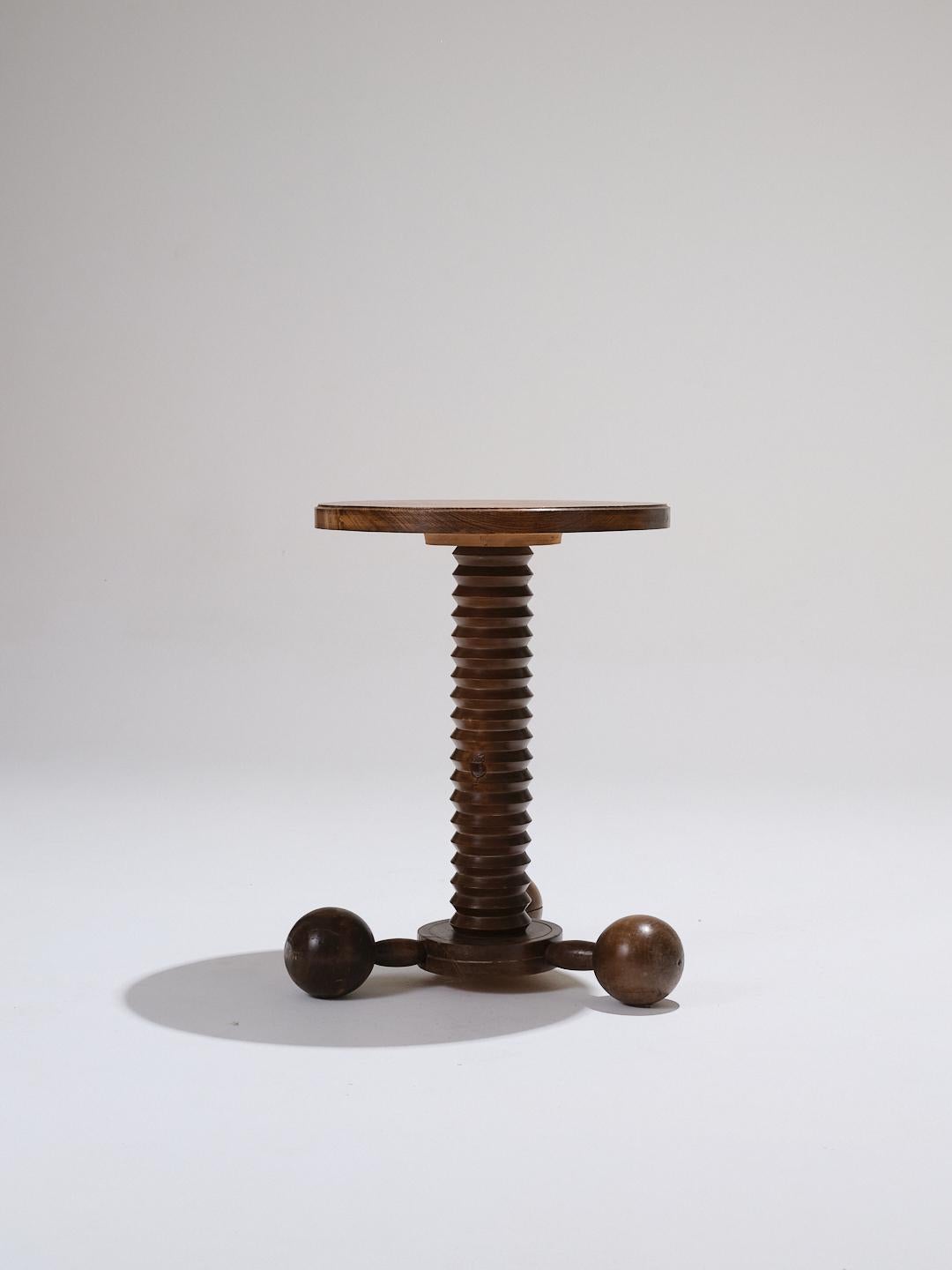 Solid oak side table, designed by Charles Dudouyt (1885–1946), a French designer of the 1930s known for his sculptural forms and woodworking.
Screw-like turned wood legs ending in three spherical feet. Very good vintage condition.

LP5831