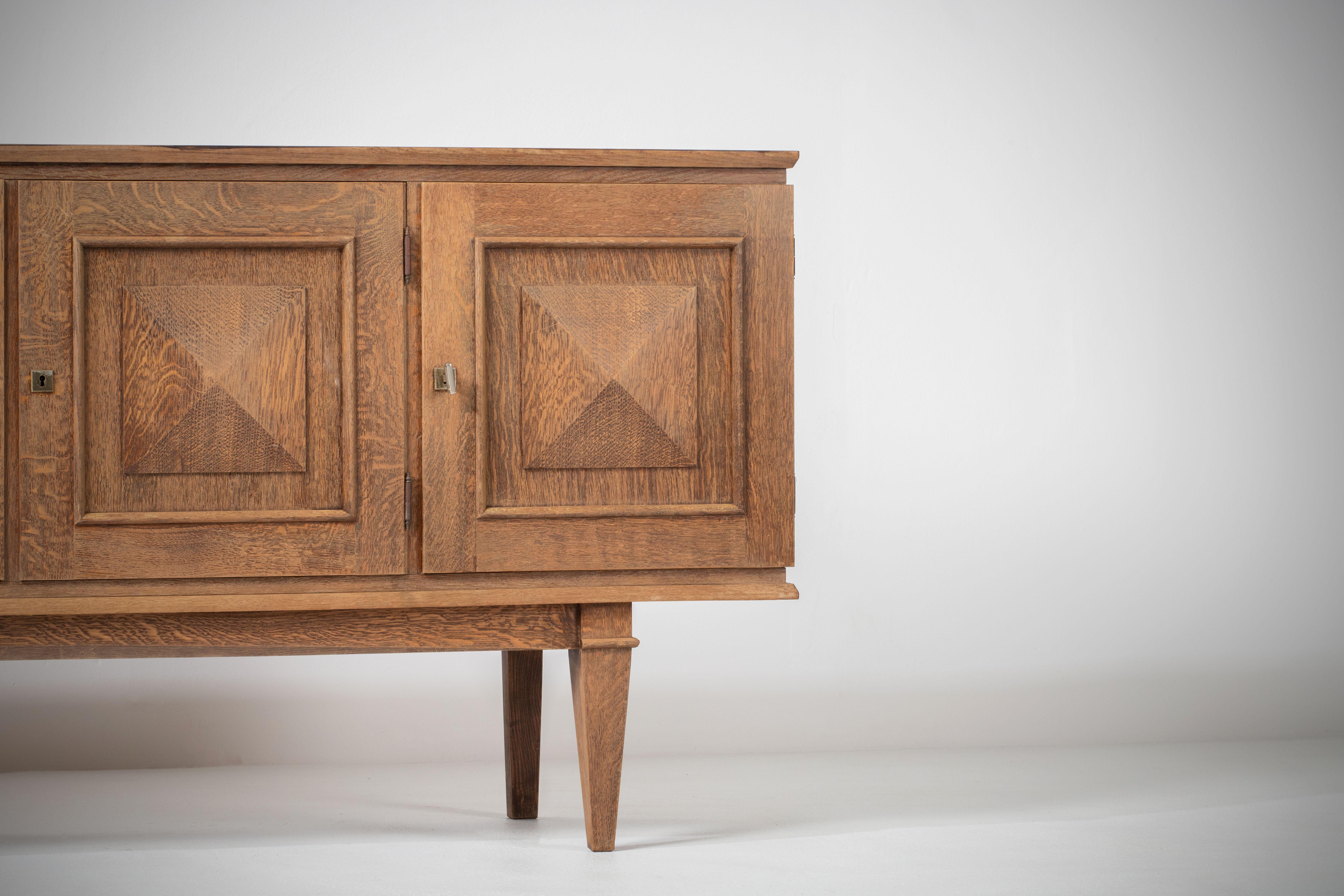 Mid-20th Century Art Deco Oak Sideboard with Handcarved details, France, 1940s