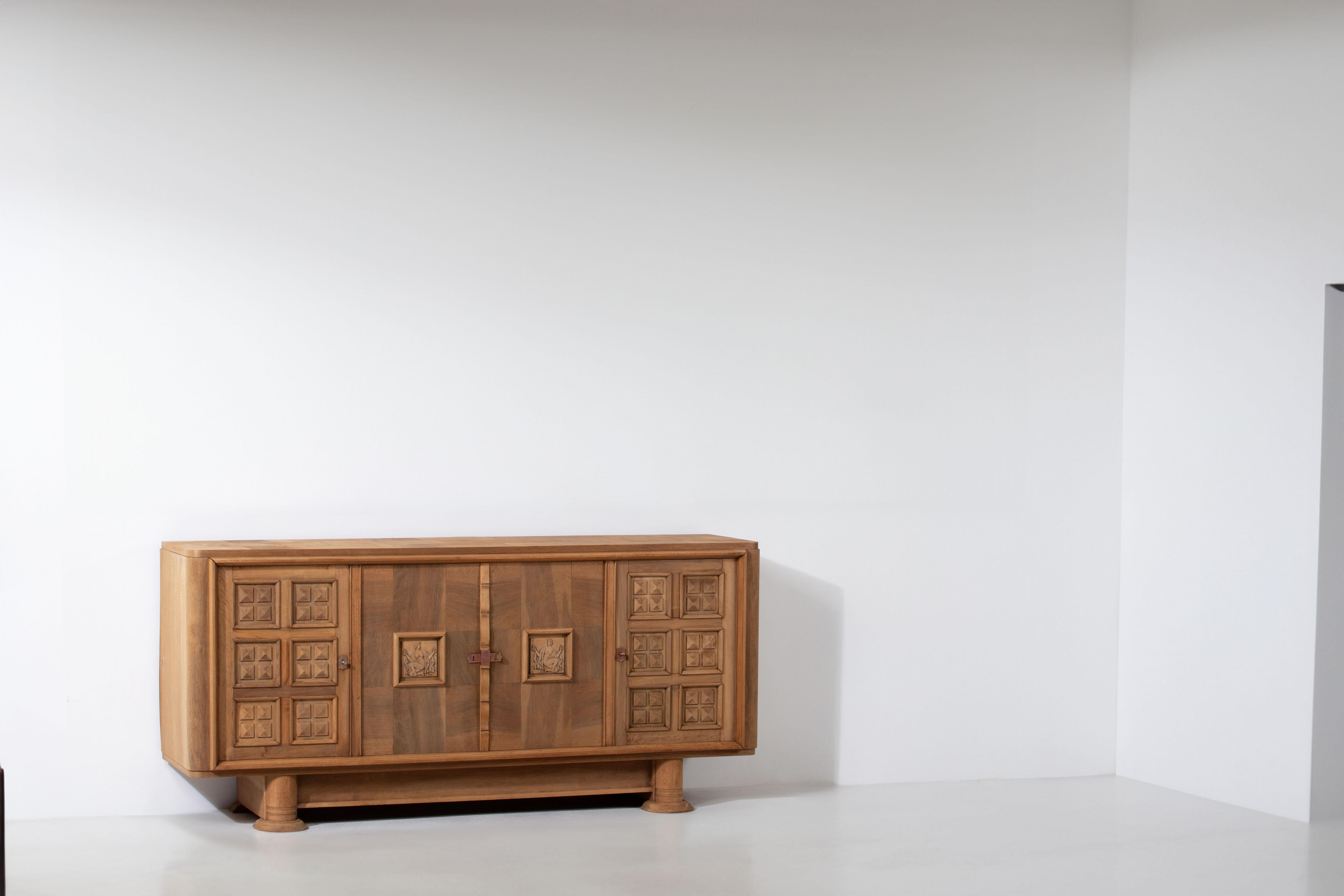 Introducing a magnificent Art Deco buffet crafted from rich mahogany, hailing from the refined craftsmanship of 1940's France. This extraordinary piece exudes elegance and sophistication, making it a captivating addition to any interior.

With its