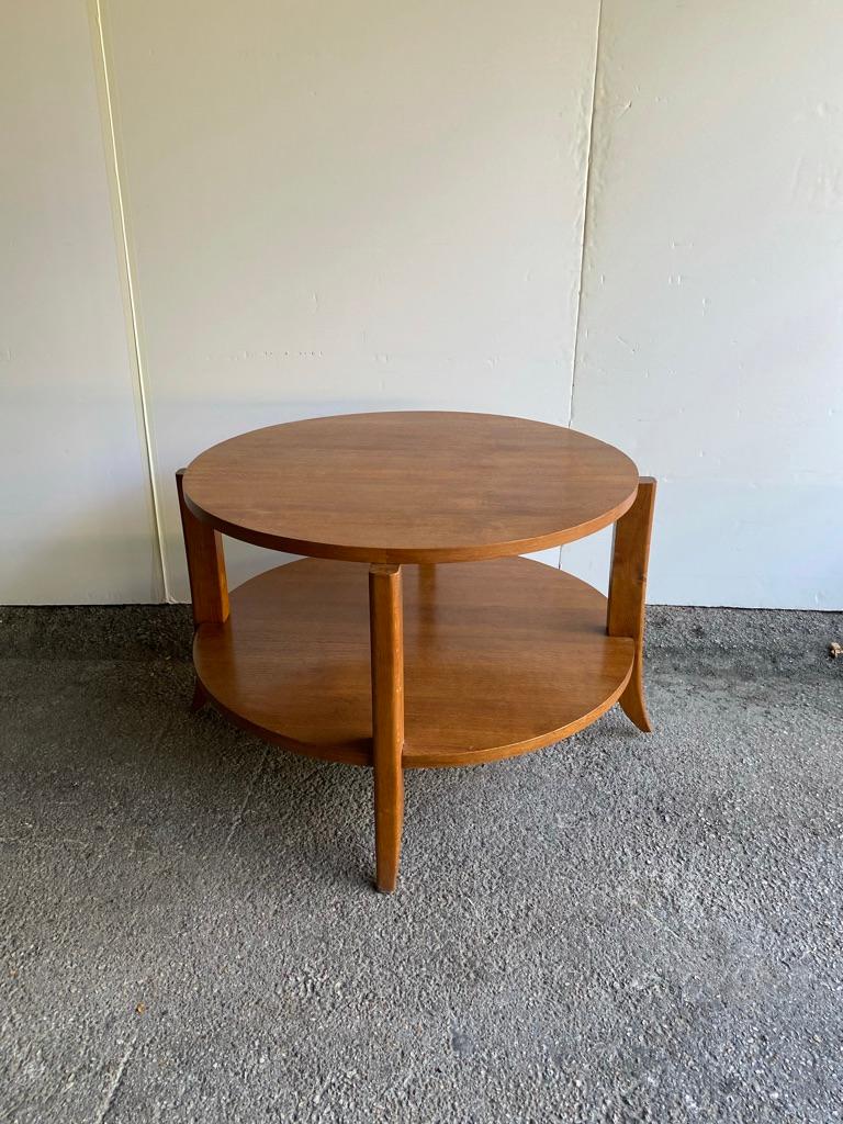 Round Art Deco table in oak with lower shelf. Heavy and beautifully crafted to serve as large side table or center table. In the style of Jean-Michel Frank, France, 1930's.
