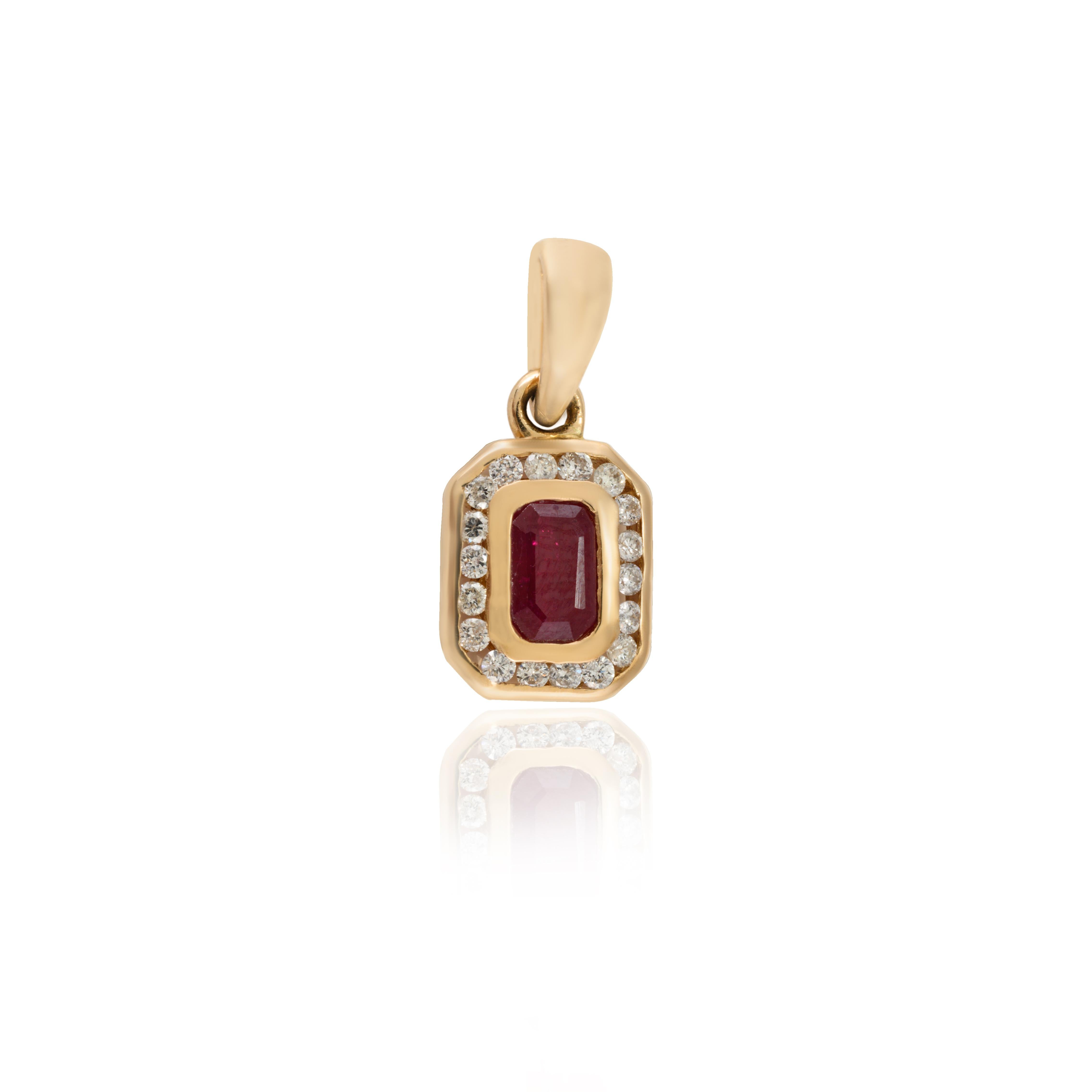 Art Deco Octagon ut Ruby and Diamond Halo Pendant in 14K Gold studded with octagon cut ruby. This stunning piece of jewelry instantly elevates a casual look or dressy outfit. 
Ruby improves mental strength. 
Designed with octagon cut ruby studded in